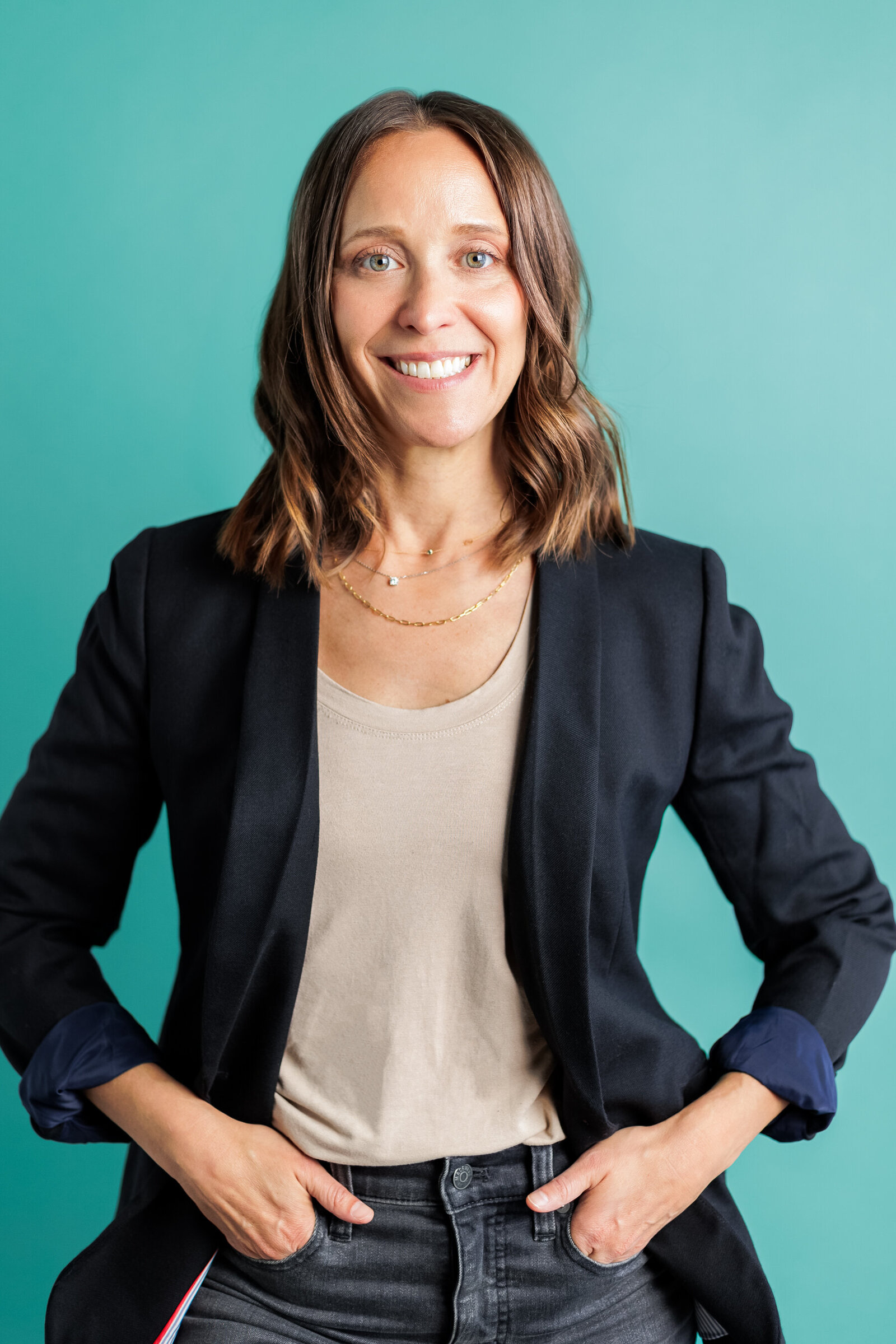 Colorful studio headshot of woman business owner in Gresham Oregon