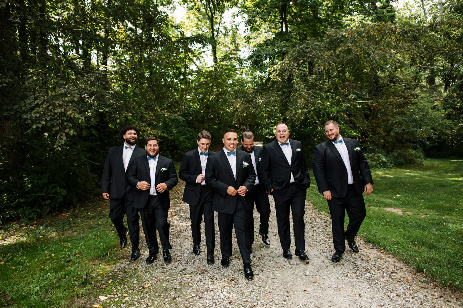 Groom squad happily walking