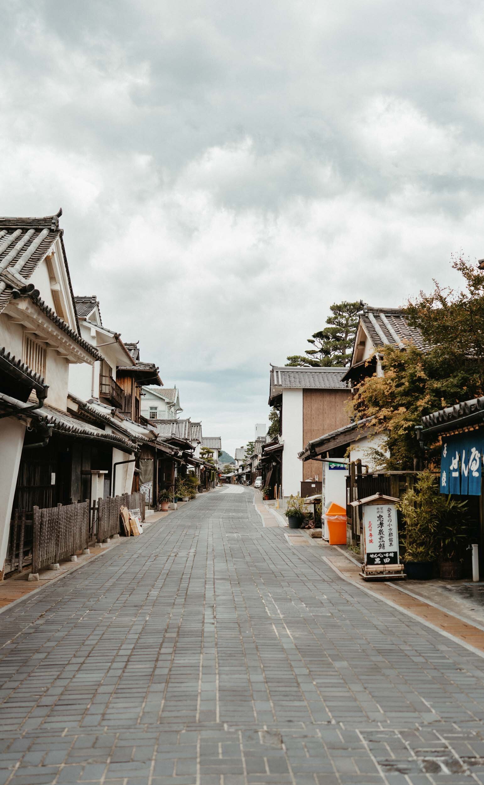 Historic street in Hiroshima’s Takehara old town, lined with preserved wooden buildings and nostalgic charm.