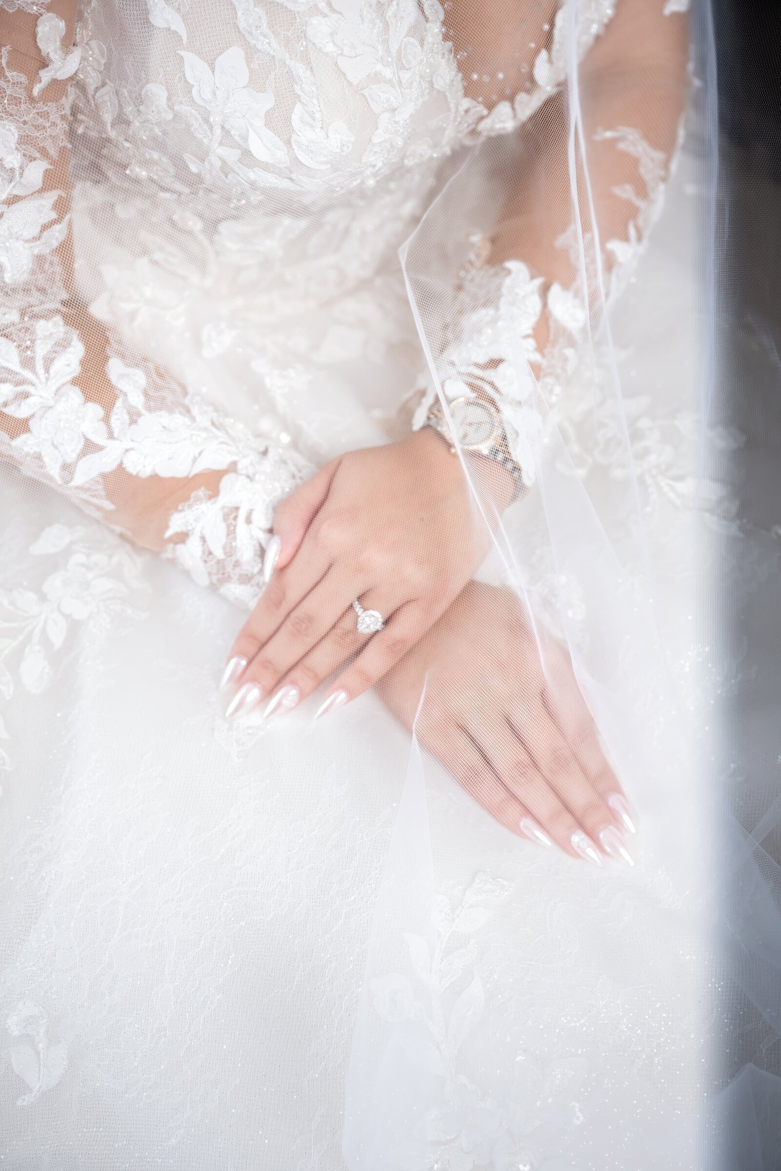 bride and groom sit nose to nose on couch