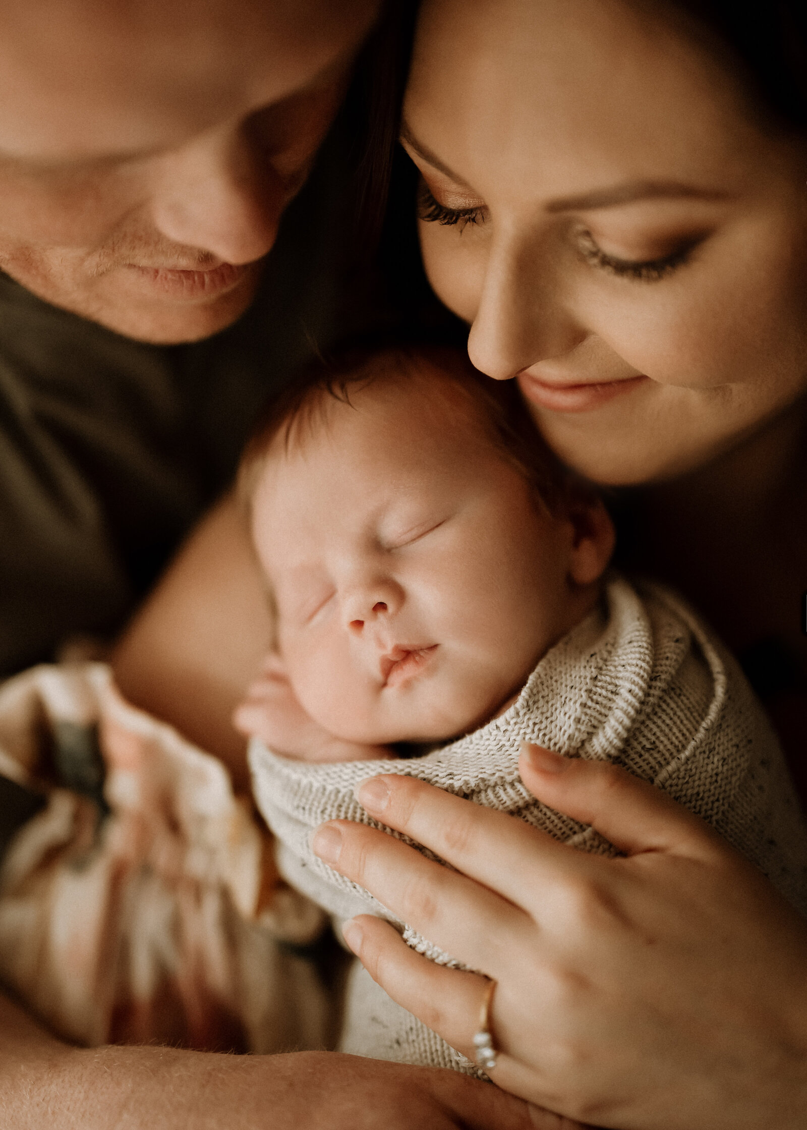 Candid newborn family photography in a Perth studio – relaxed, emotional, and full of love.