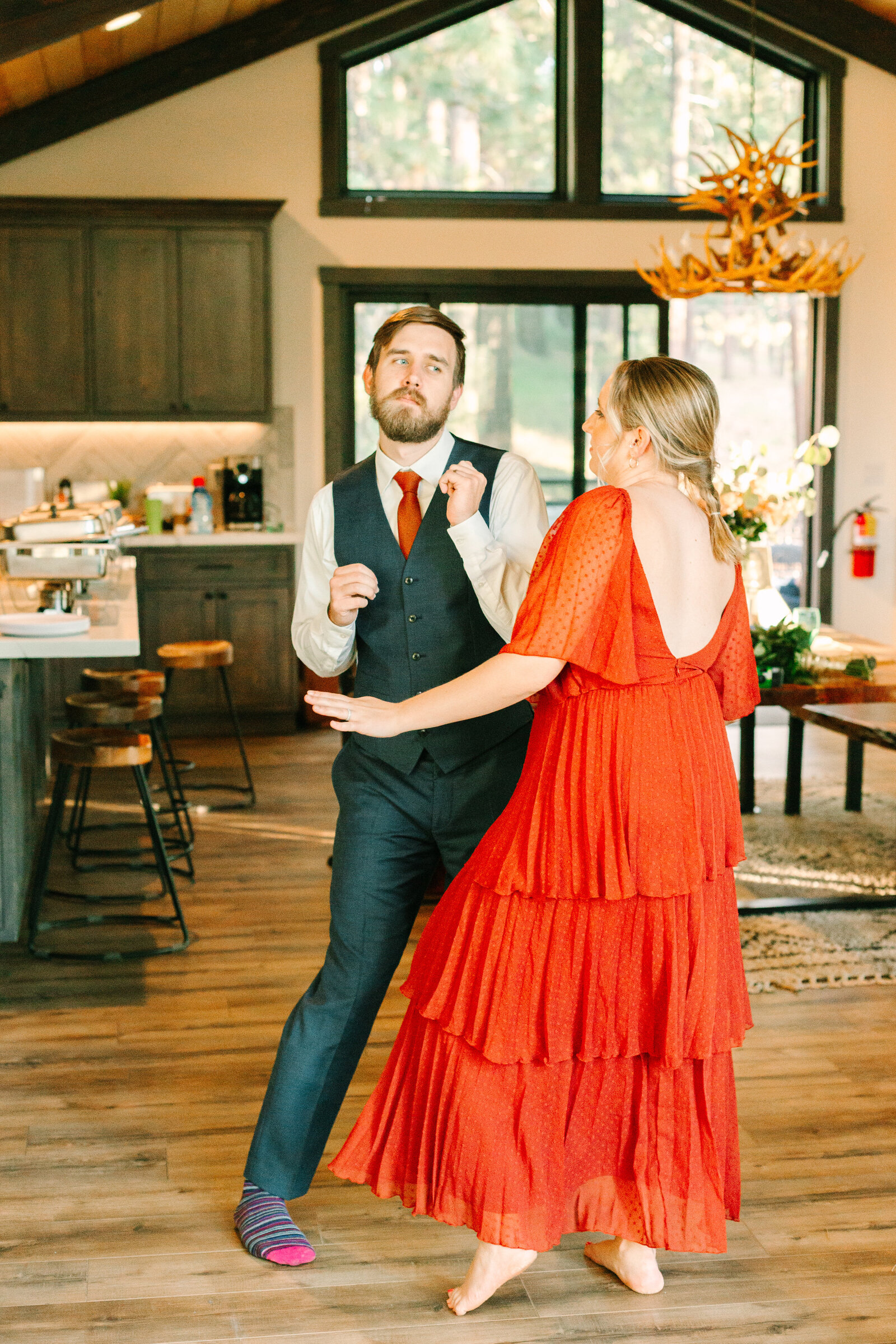 The bridal party celebrates an intimate elopement at a cabin at Big Bear Lake, California.