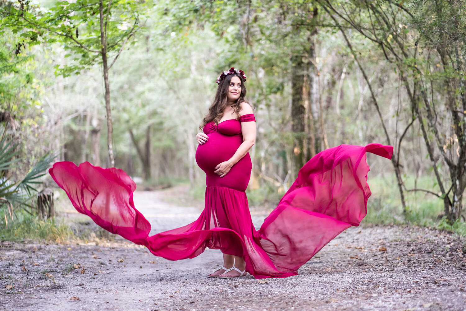 Maternity portrait in Fontainebleau State Park with dress blowing in the wind