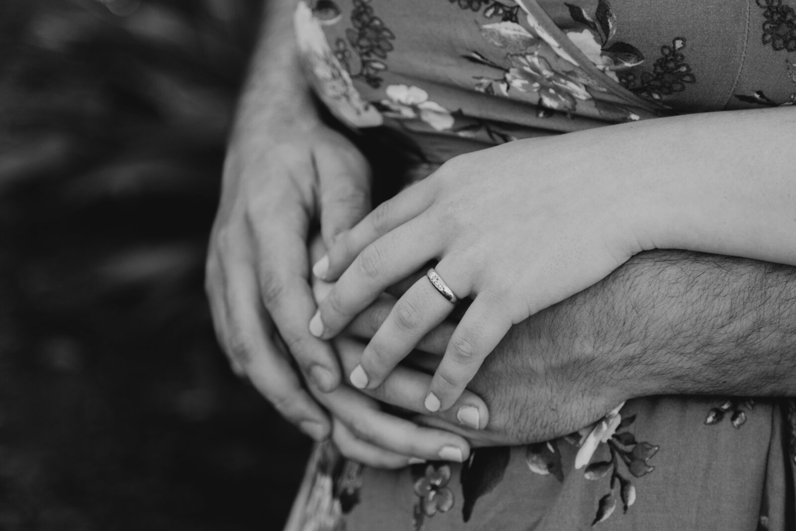 An engaged couple poses for photos in a garden in Los Angeles, Ca.
