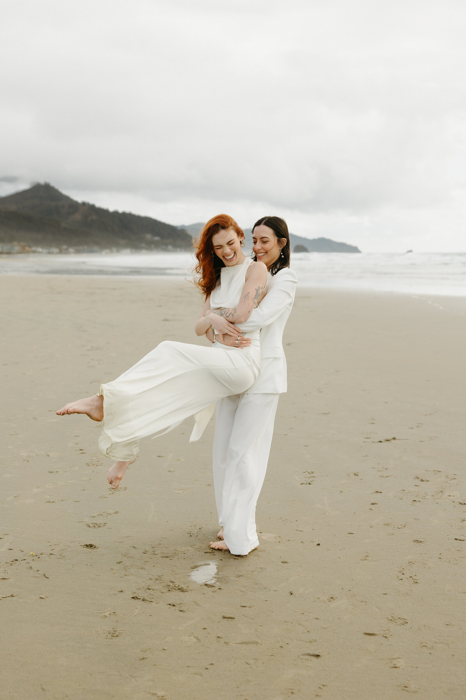 Two brides pose playfully for their bridal portraits in Nova Scotia. 