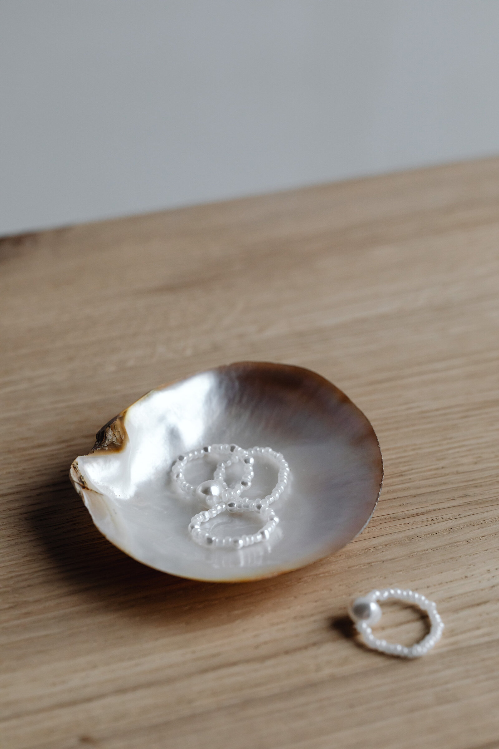 kaboompics_pearl-and-white-bead-rings-25210