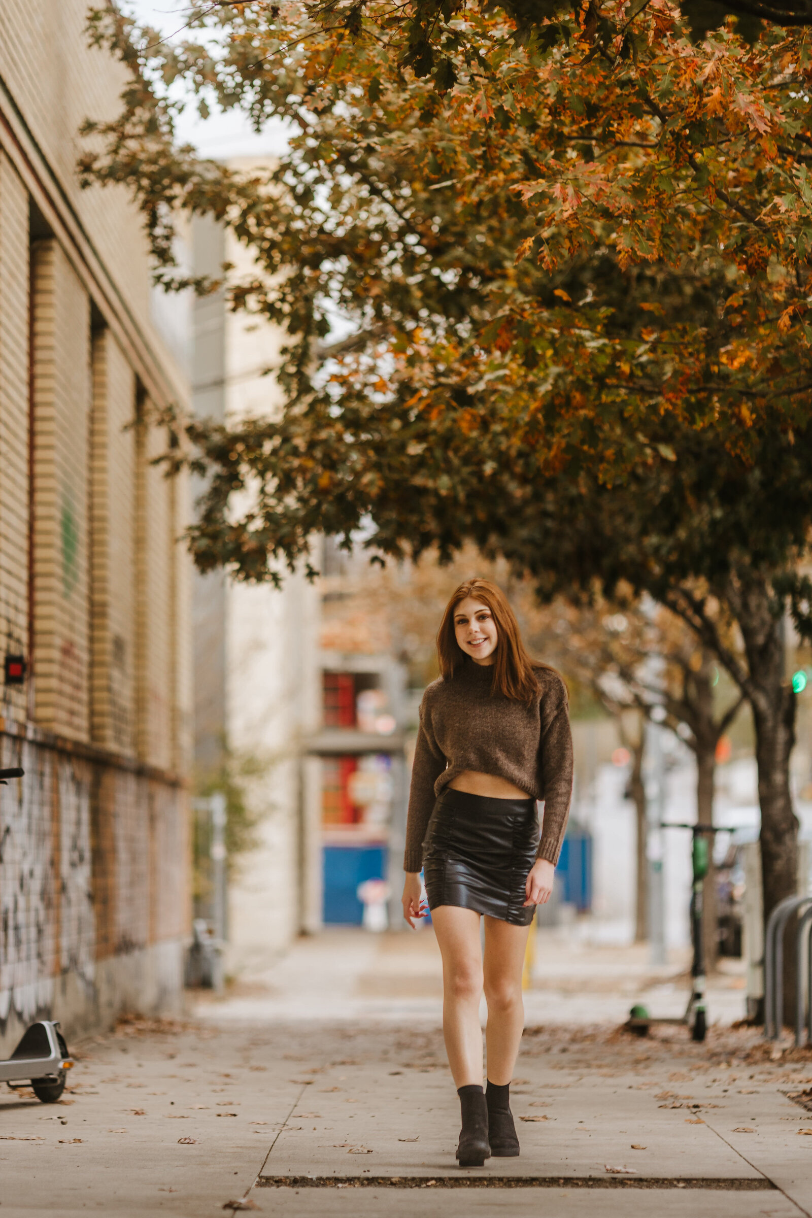 high-school-senior-walks-on-street