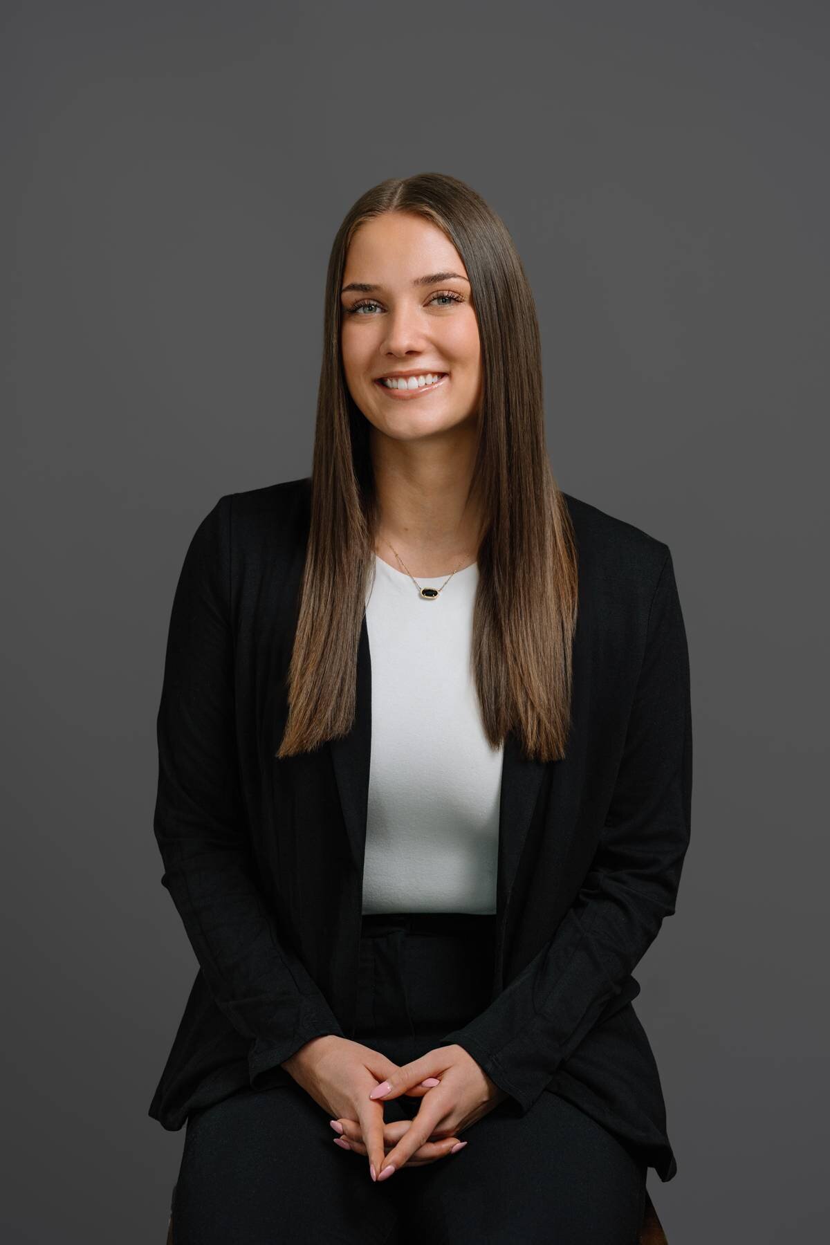 Professional business woman in a studio setting, exuding confidence and professionalism in her career