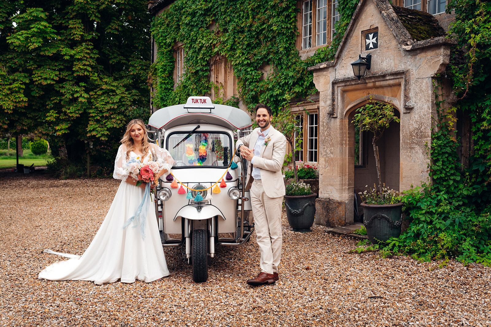 Tuk tuk ride at sunset, as couple exit their cotswold wedding celebrations