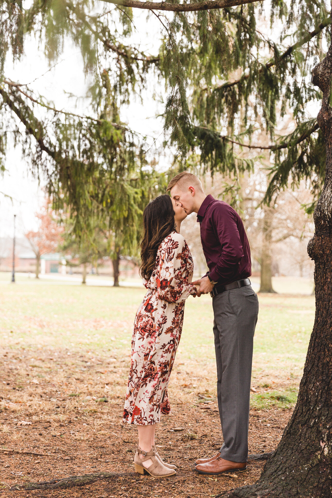 engaged couple kissing in springtime session ohio