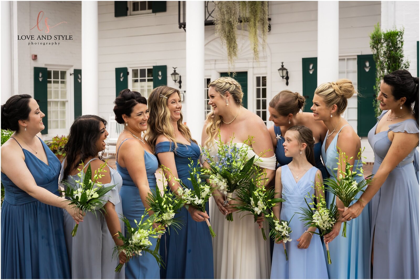 Bridal party celebrating with the bride and groom on their wedding day in Sarasota.