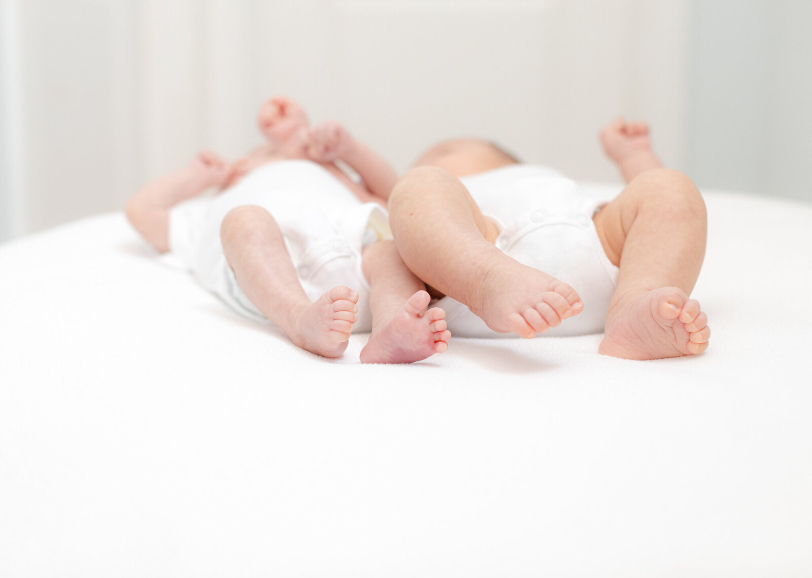 twin babies close up image of toes