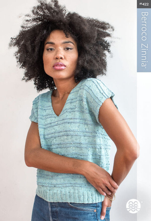 Natural makeup for model wearing blue sweater