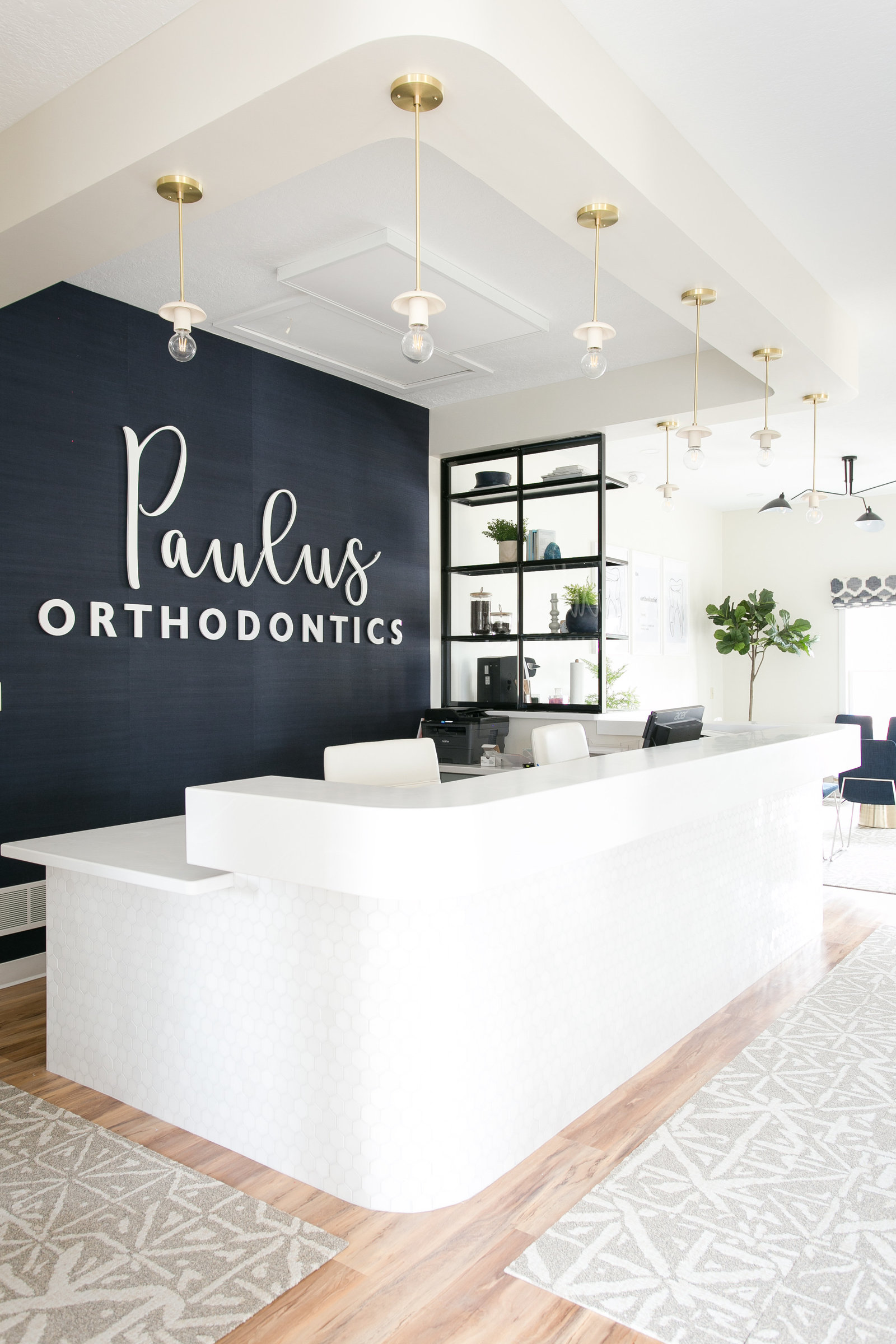 Boutique style Orthodontist office with modern receptionist desk design