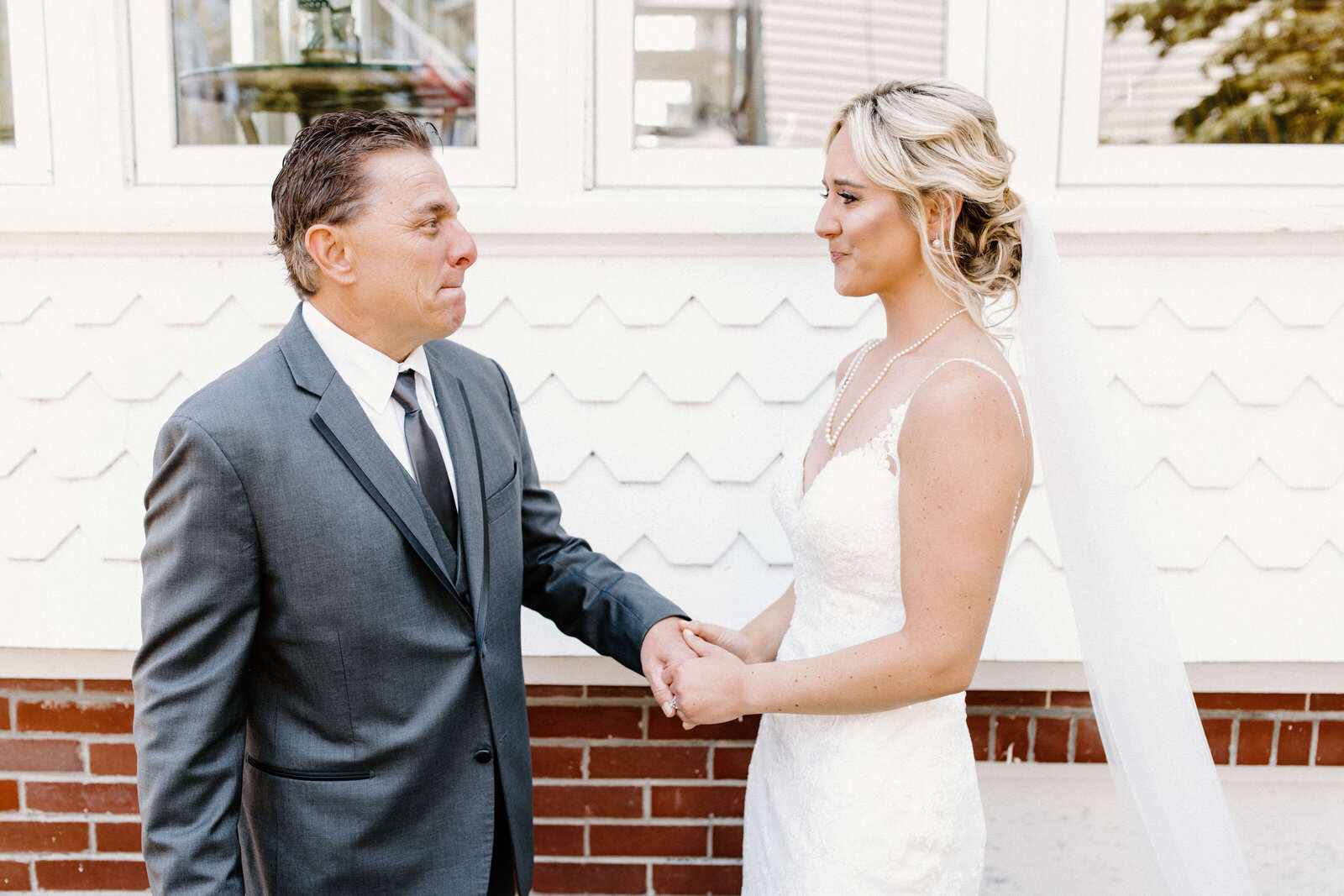 bride does first look with father on wedding day emotional photograph by sabrina leigh