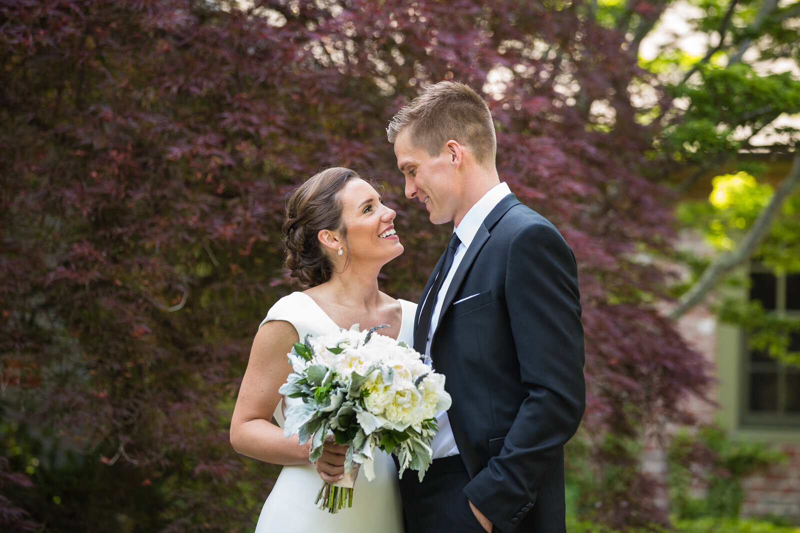 bride looks lovingly up at groom