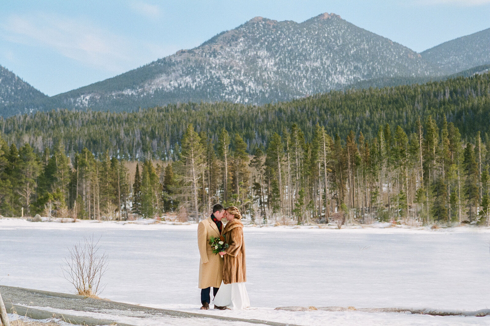 Bride and Groom together at RMNP during winter Colorado Wedding