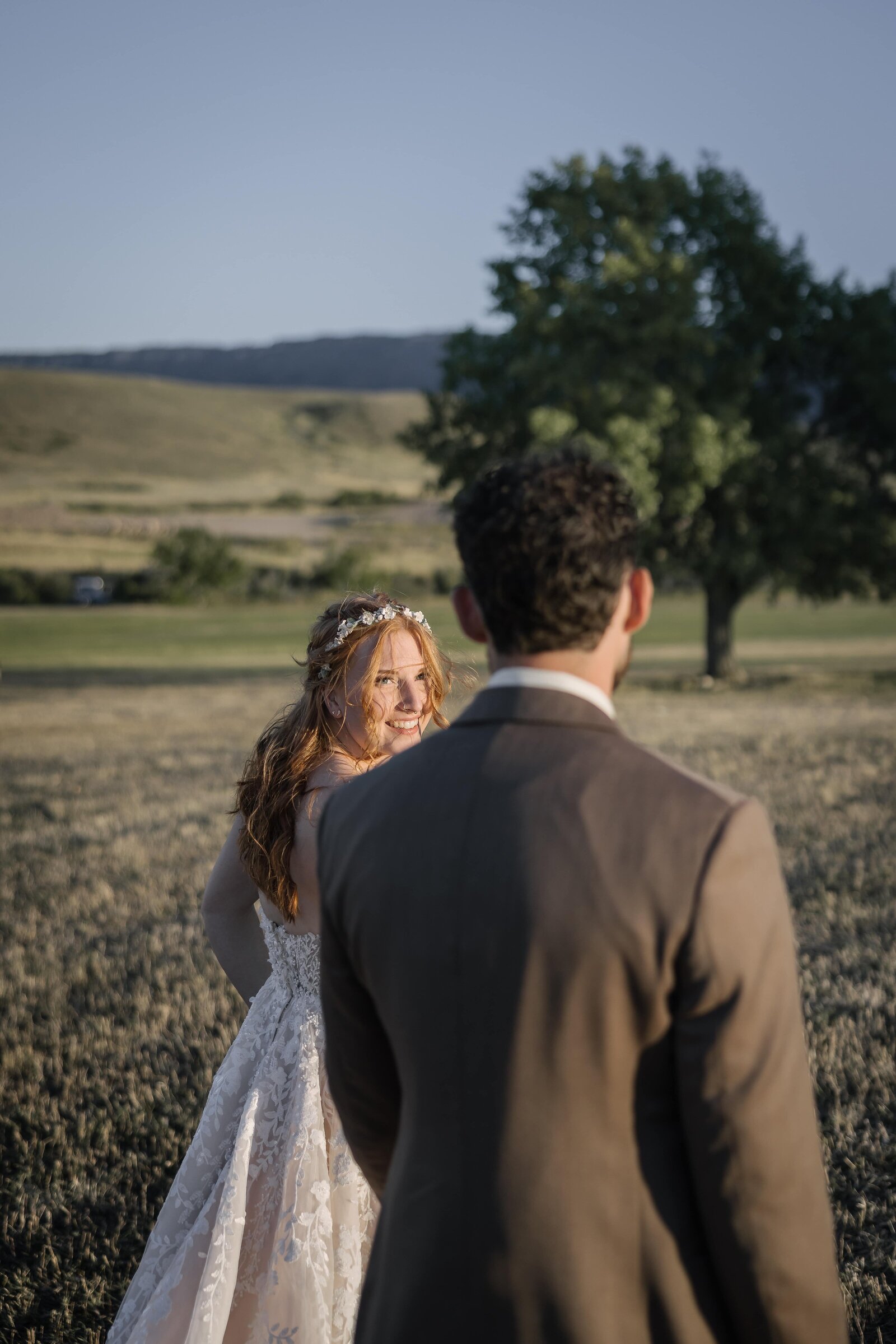 bride leading groom in summer bridals