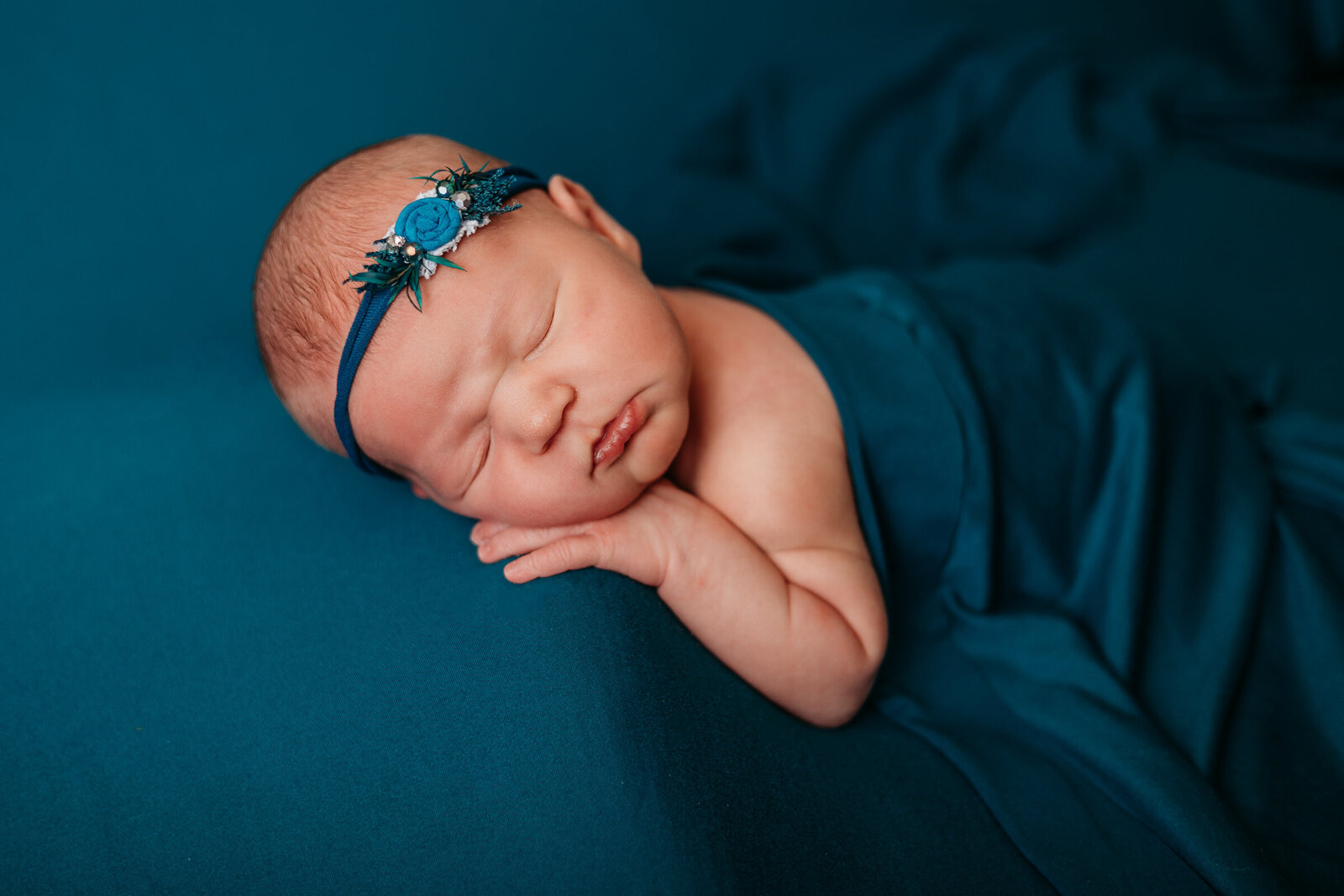 Baby girl in blue newborn session