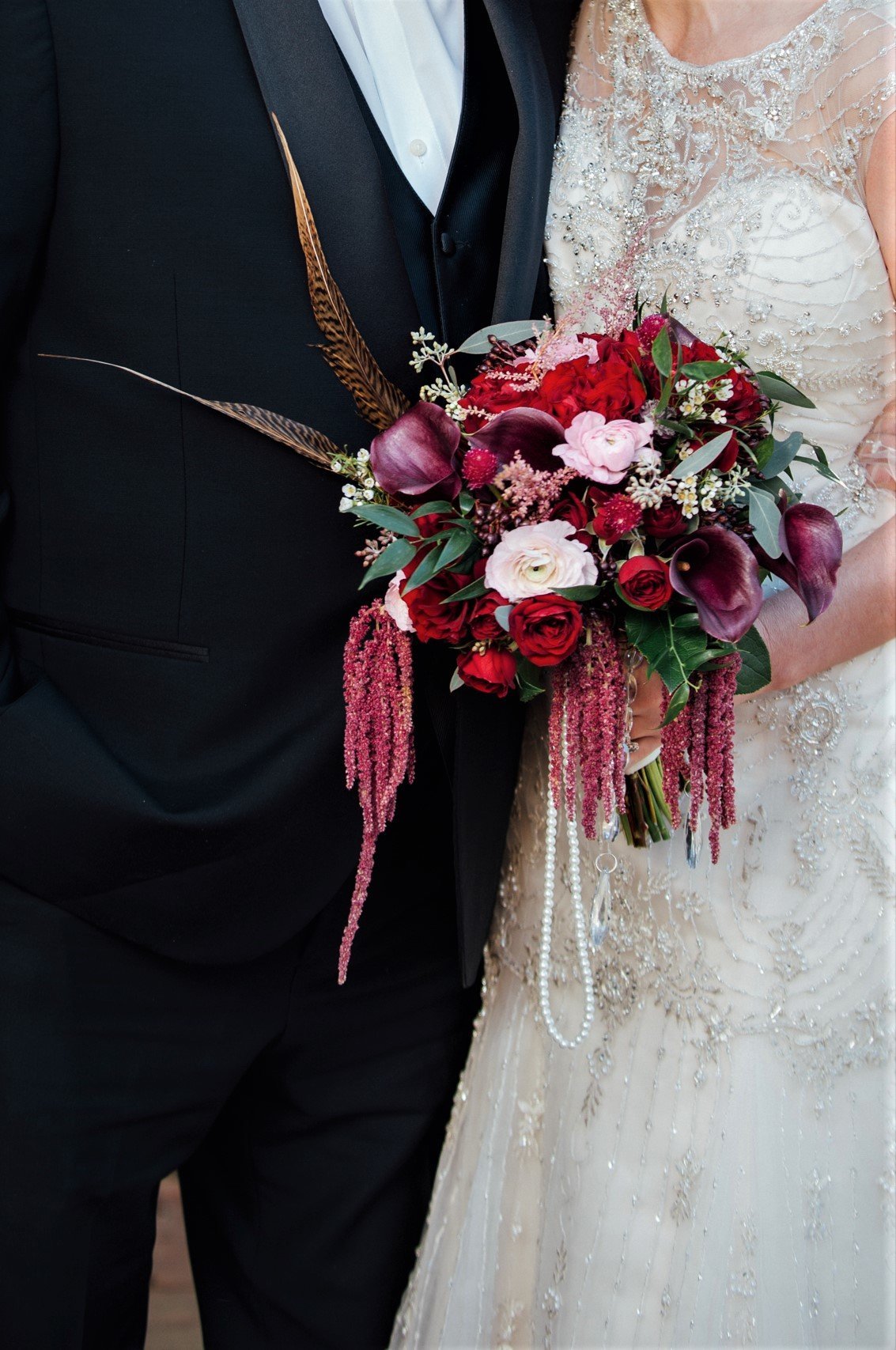 Bridal bouquet with pearls, crystals, and feathers