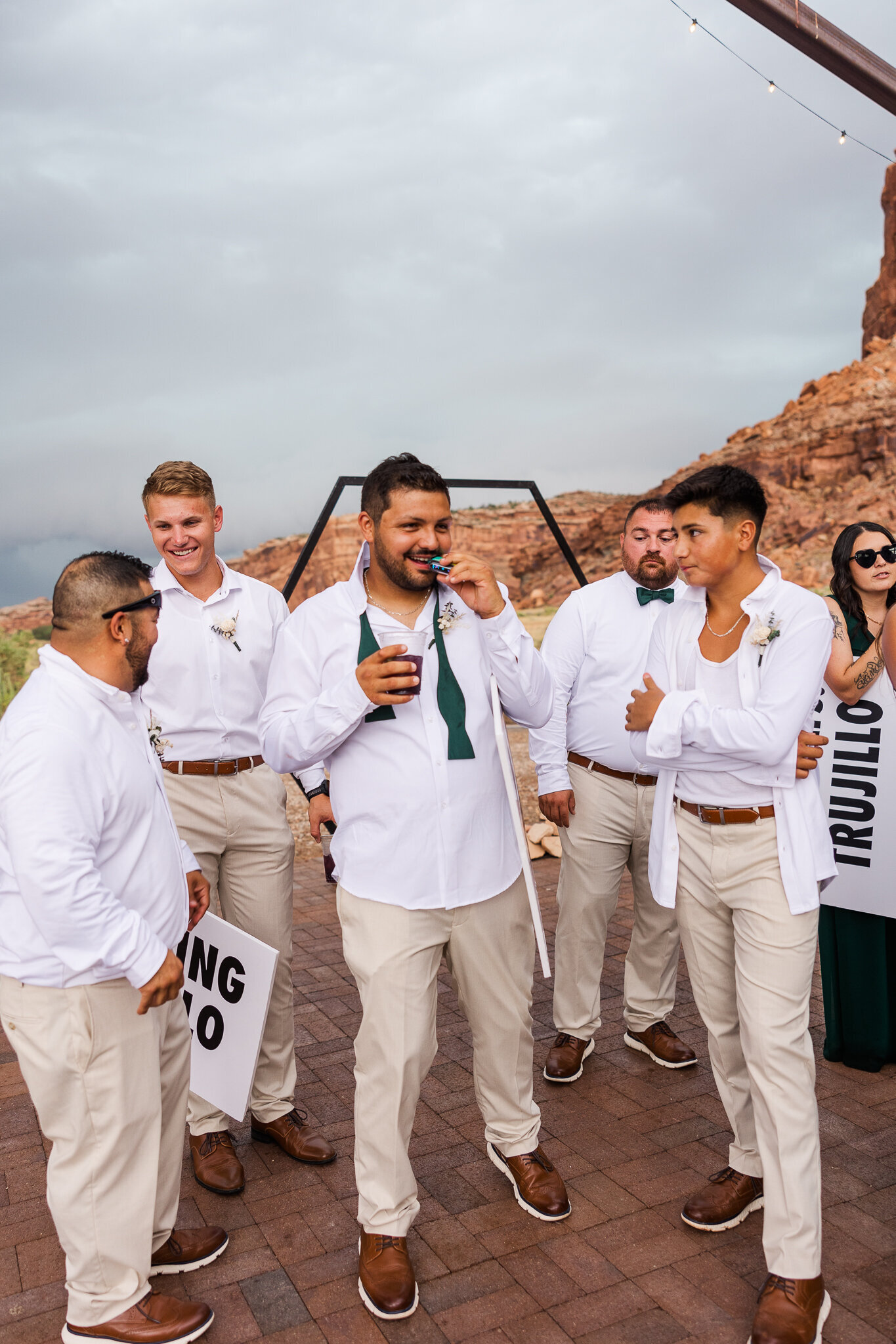 Groomsmen hanging out after ceremony in Moab Utah