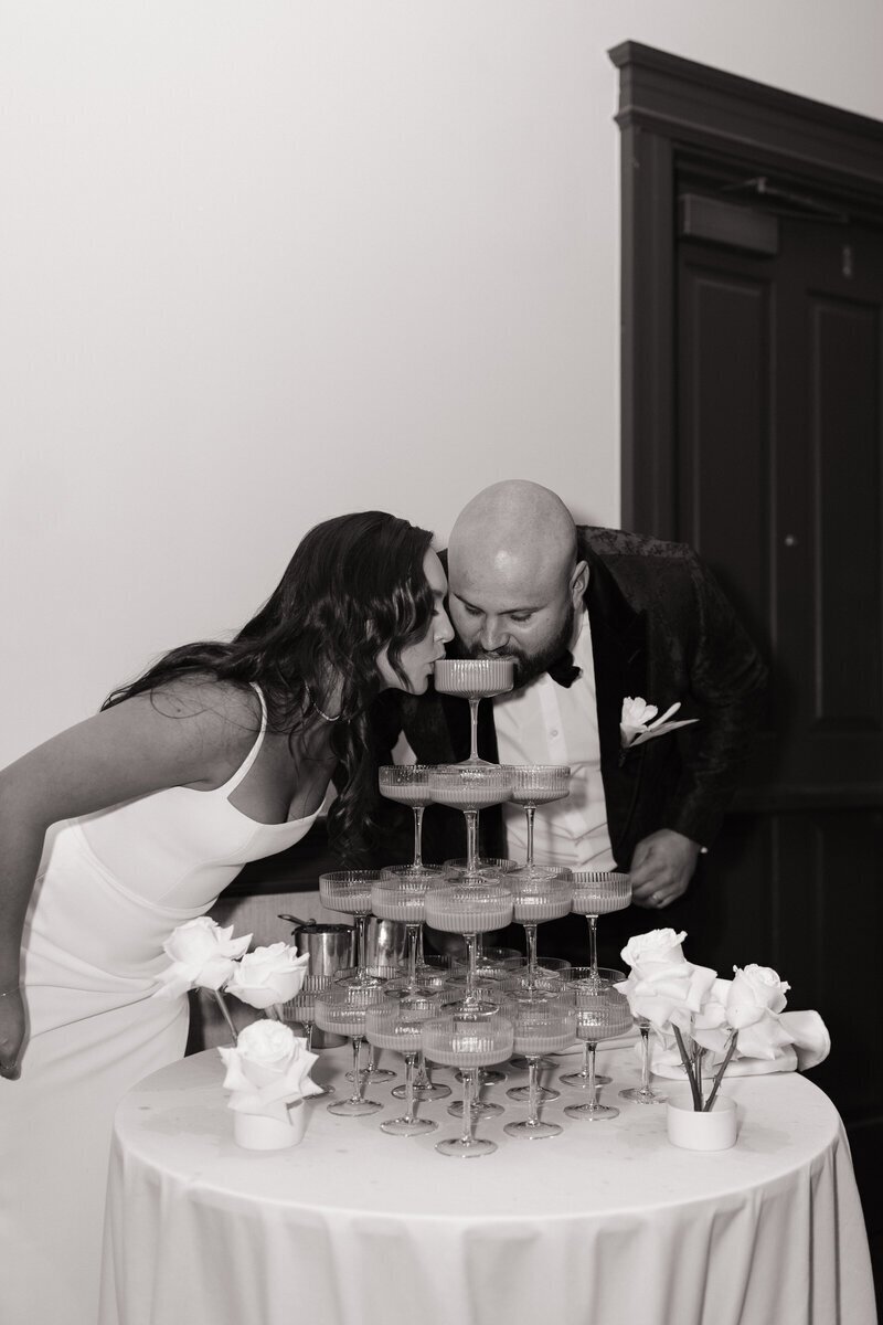 couple drinking from champagne fountain idaho wedding photography by Erica Rochelle photography