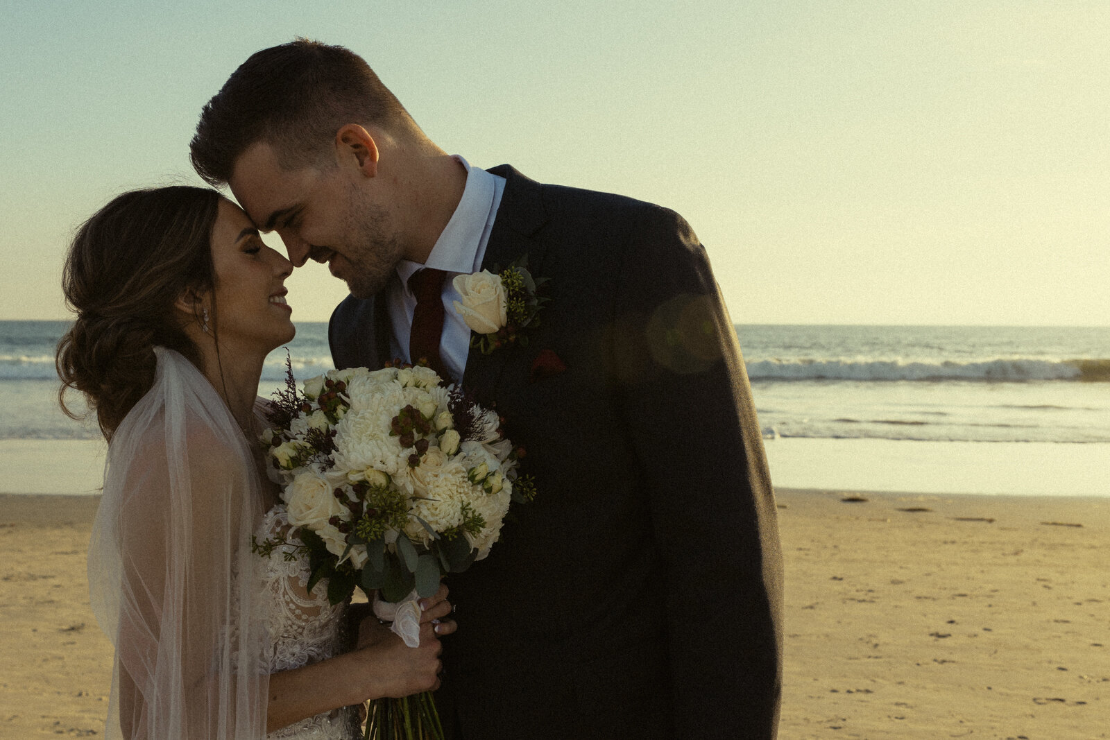 Thuy Tran Photos captured Amanda and Matt's wedding at Coronado beach in San Diego. 