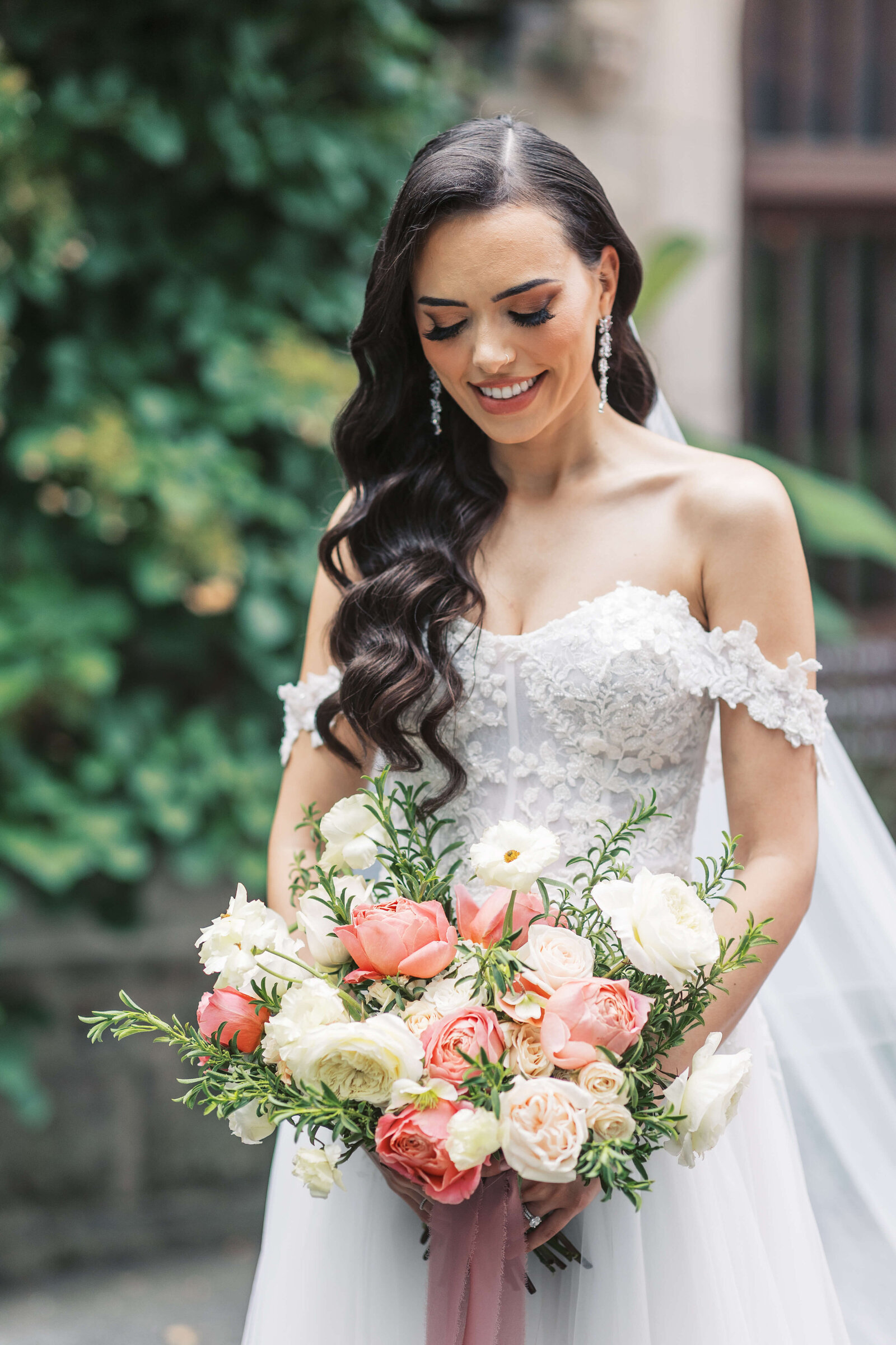 Bride admires her beautiful bouquet designed by New Jersey Florist, Bespoke Florals.