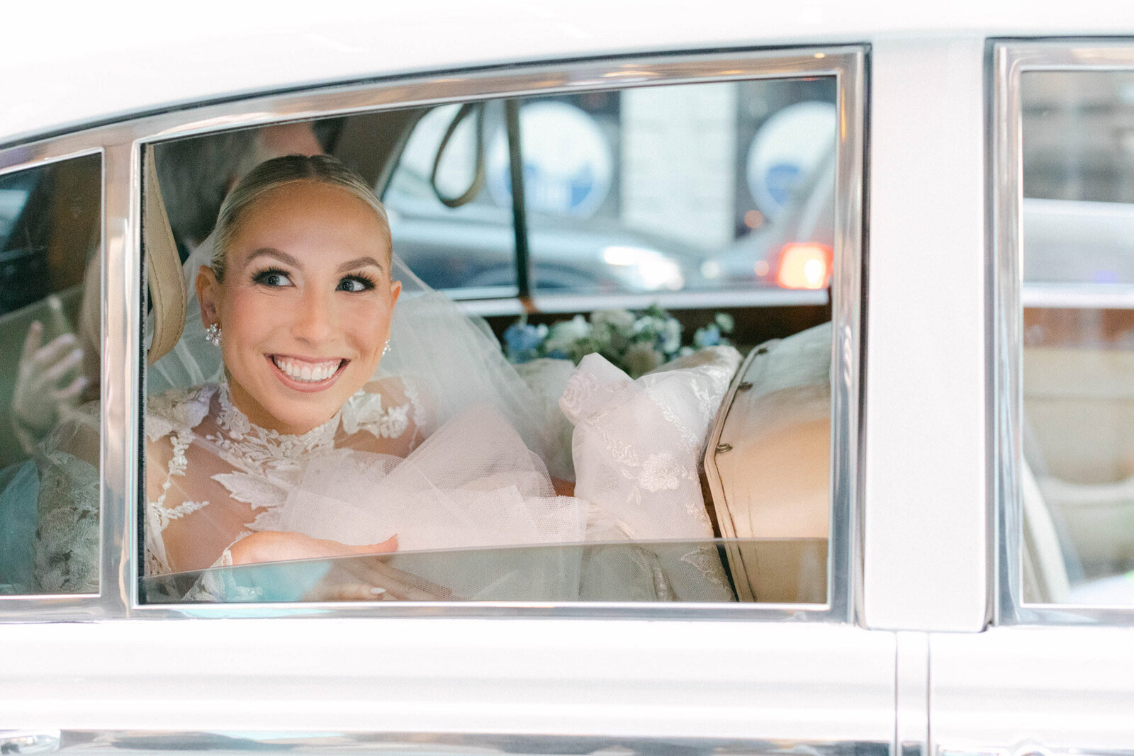 bride riding in classic car
