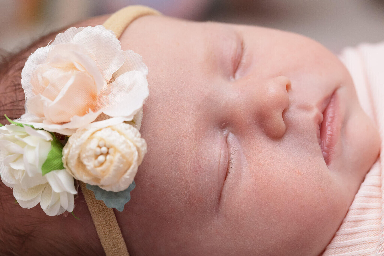 A close-up of a baby girl's sweet facial features.