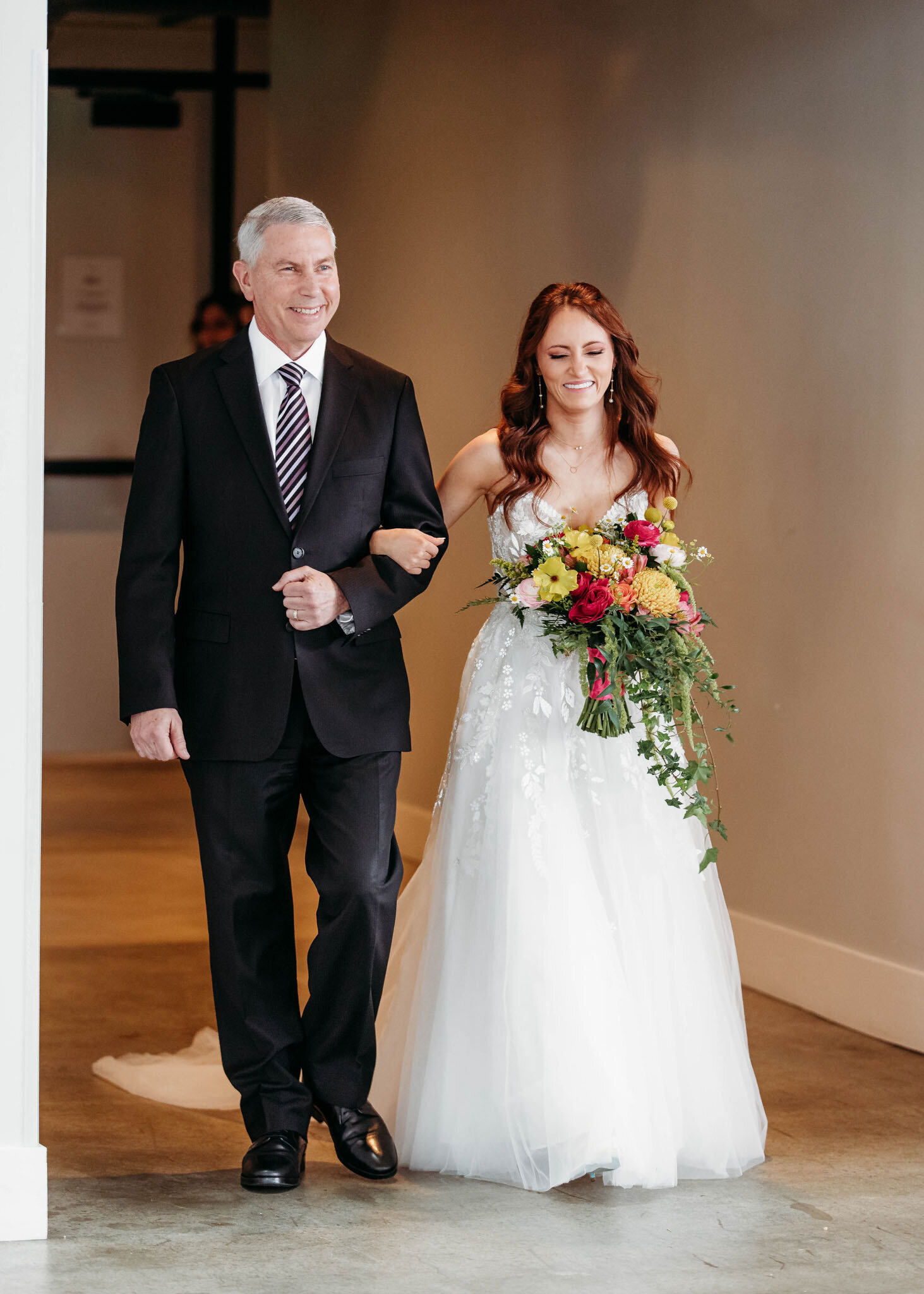 Bride and her father walking down the isle 