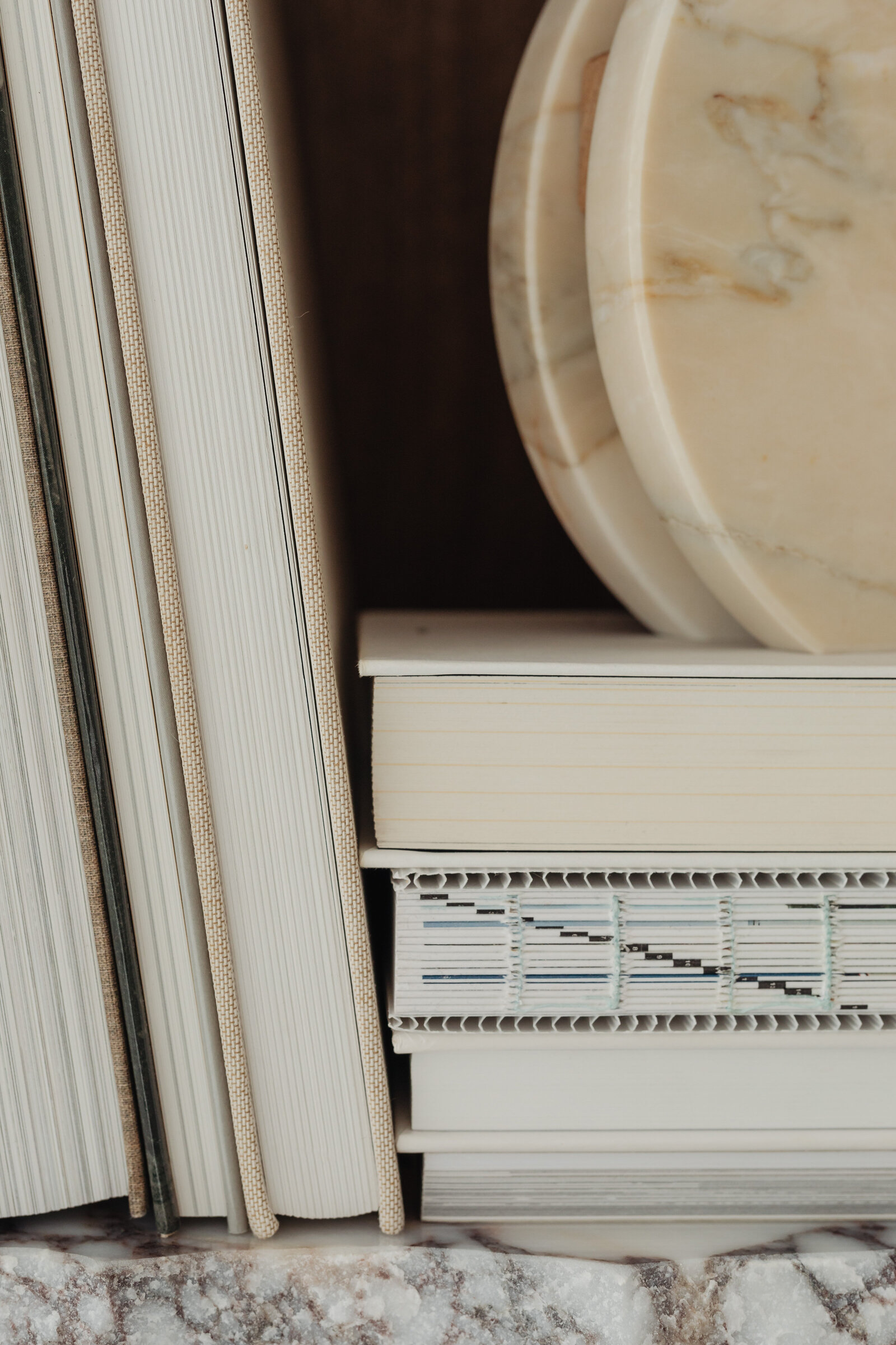 kaboompics_books-on-a-bookcase-marble-shelves-27390