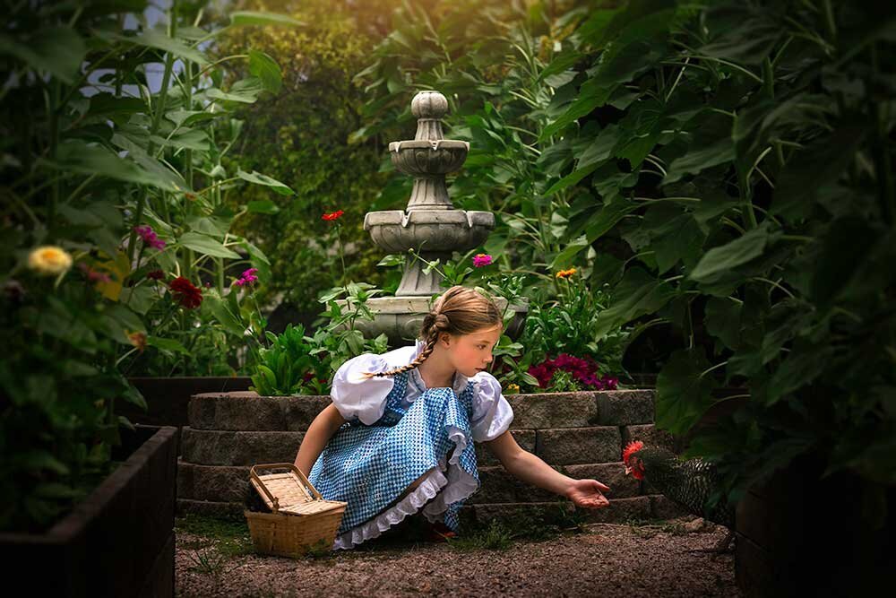 feeding-chicken-girl-timeless-classic-vibrant-secret-garden-cinematic-wizard-of-oz