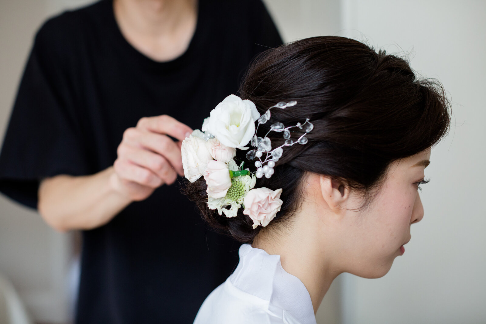 A bride having her wedding hair styled