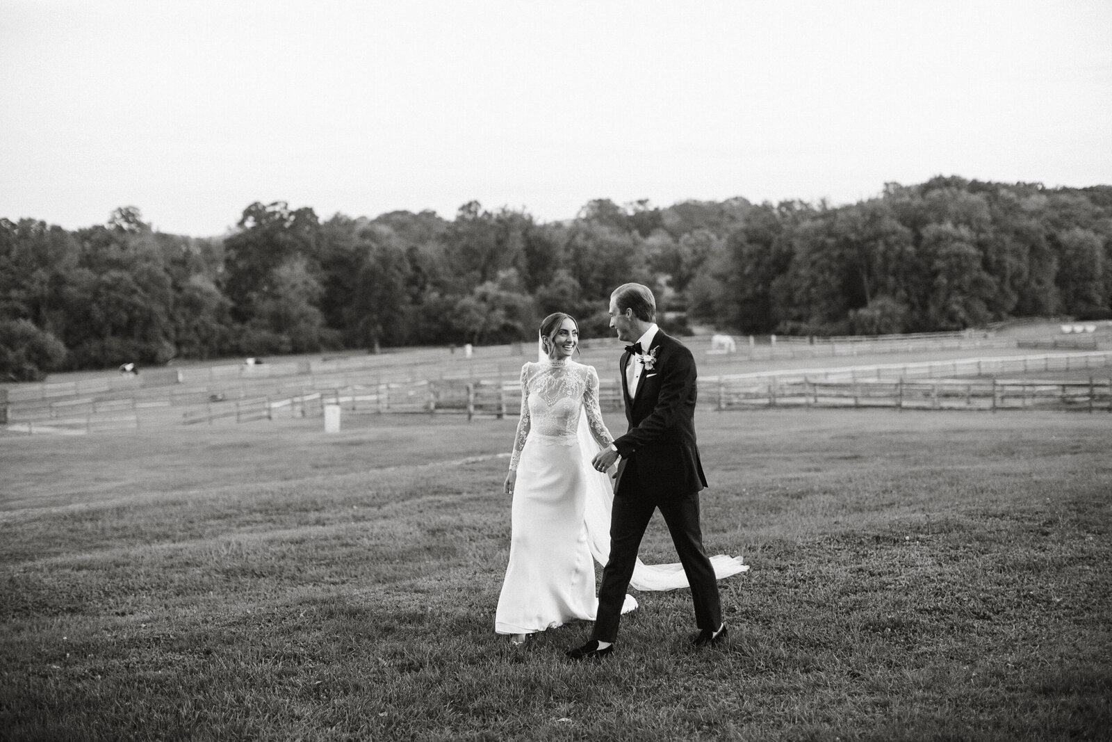 Bride and groom walking hand in hand at this outdoor venue near Philadelphia, Pennsylvania. 