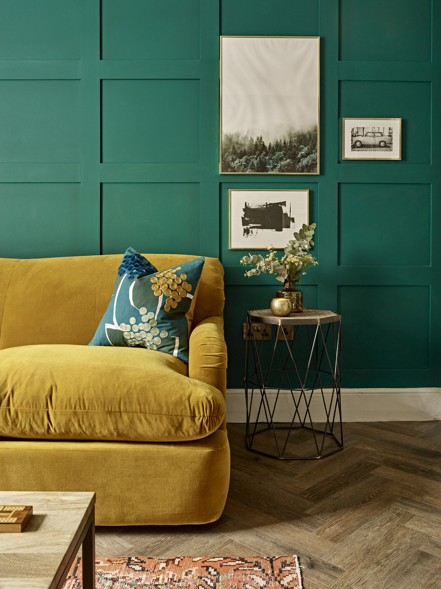 peacock green and teal wall with mustard yellow couch