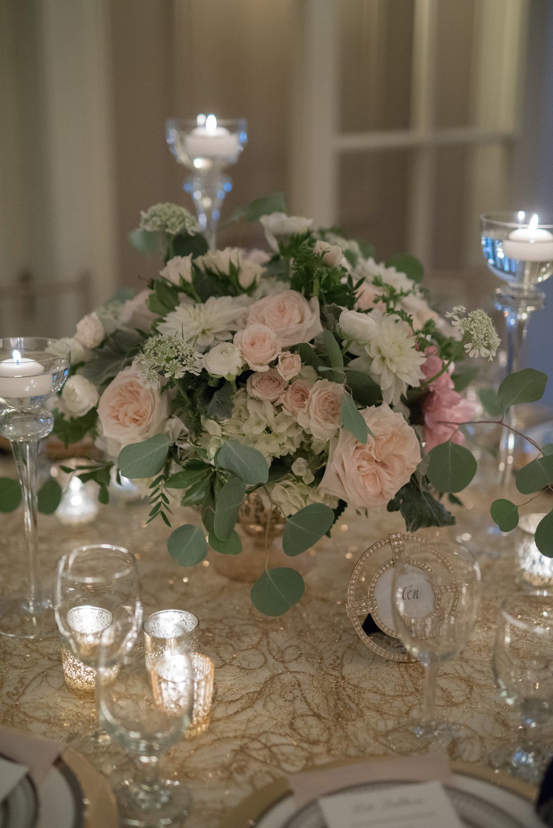 Classic wedding tablescape and placesetting in gold, champagne, silver, white and blush at Lord Thompson Manor, CT