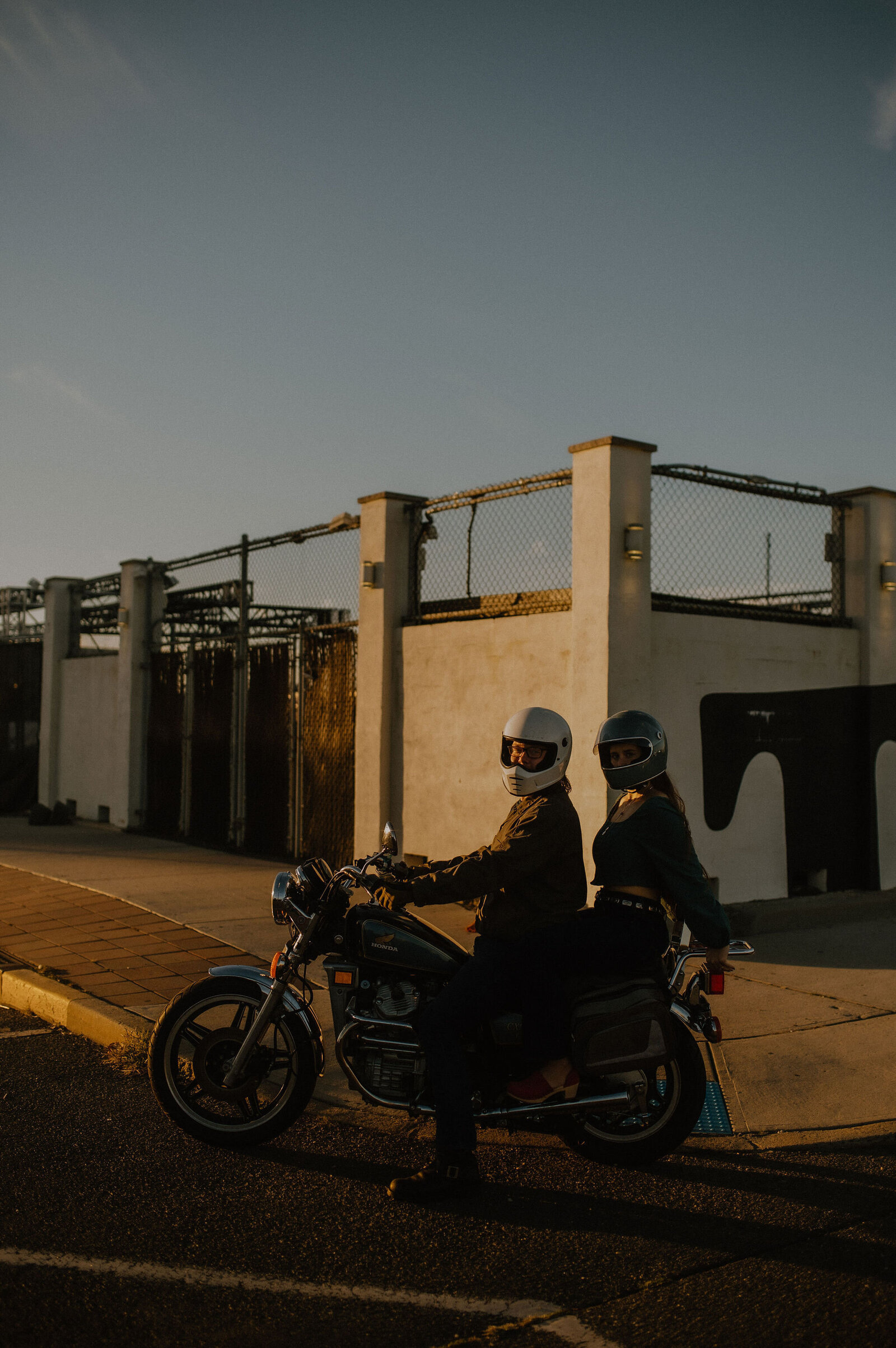 Couple on a motorcycle at golden hour