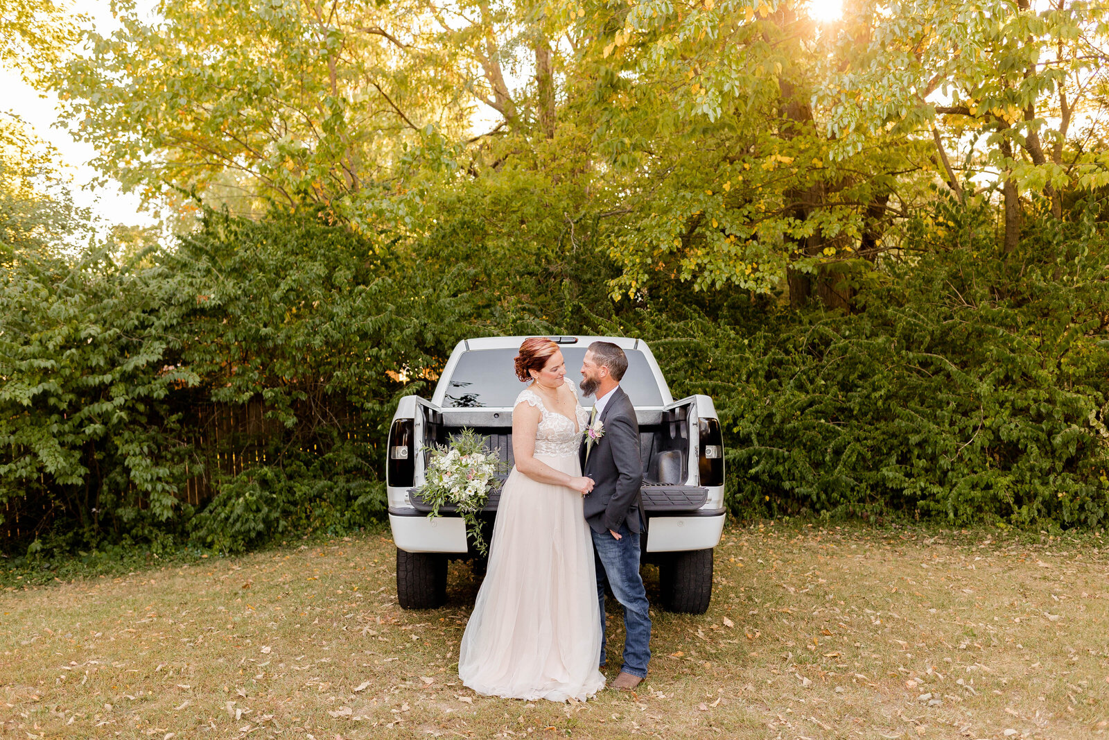Just married couple sharing a joyful moment during their elopement at Marry Me Cottage in O’Fallon, MO, captured by Style & Grace Photography.