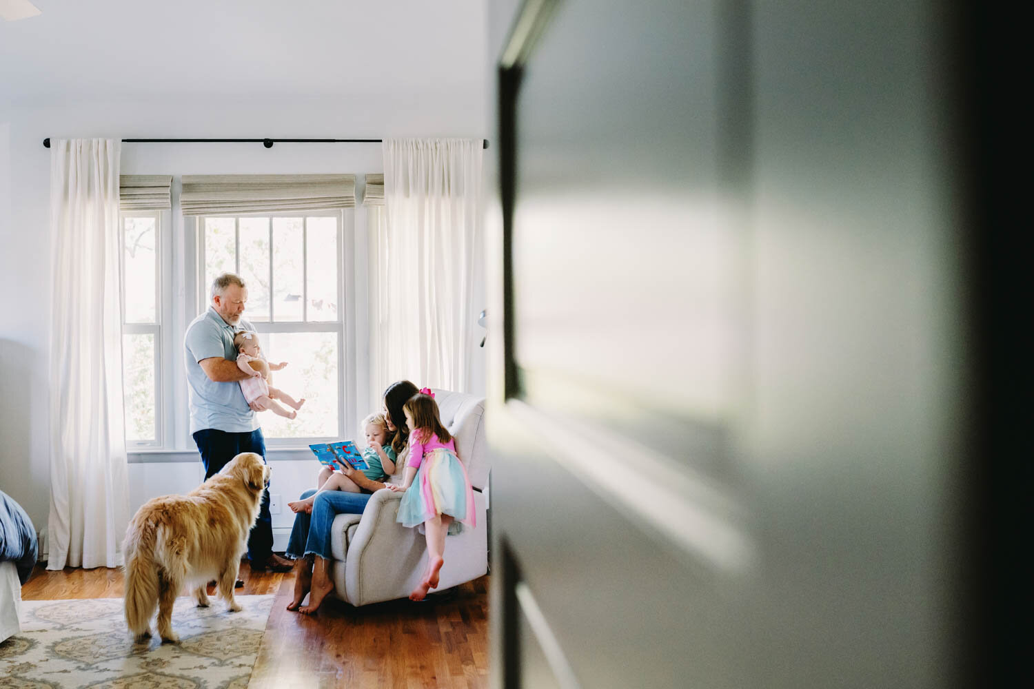 family dancing in their mclean, va living room