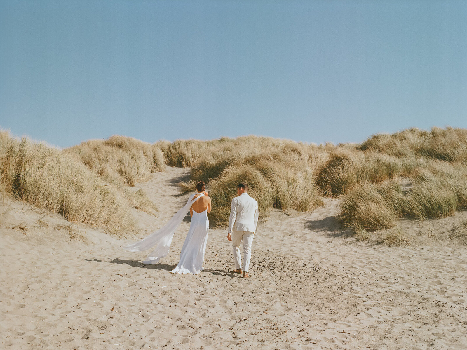 creative travel wedding photo of bride and groom in  Greece