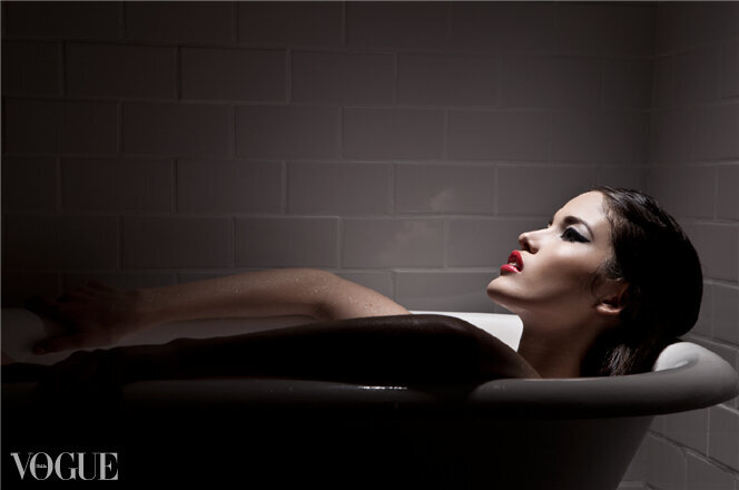 Makeup for model laying in vintage bathtub