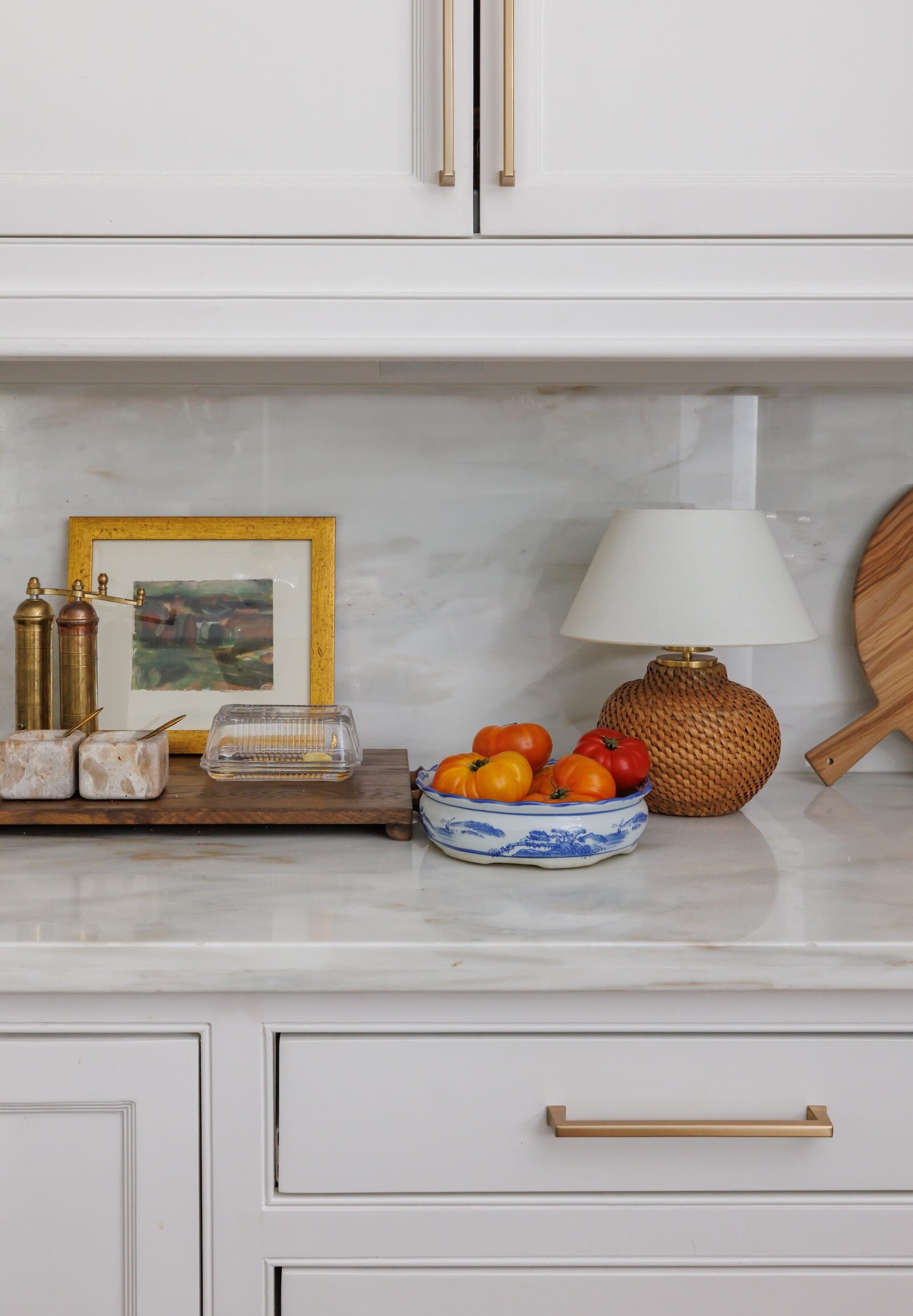 vision and hammer interior design kitchen counter with gold frame and bowl of tomatos