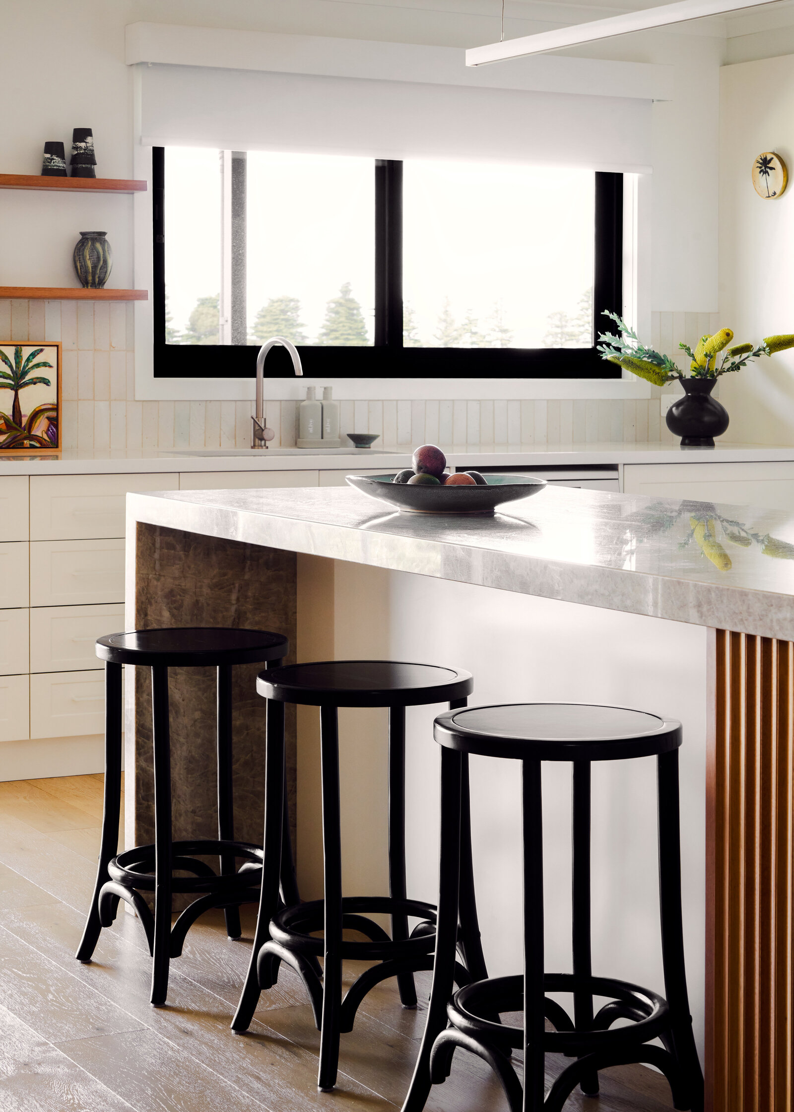 Black kitchen stools with stone benchtop kitchen
