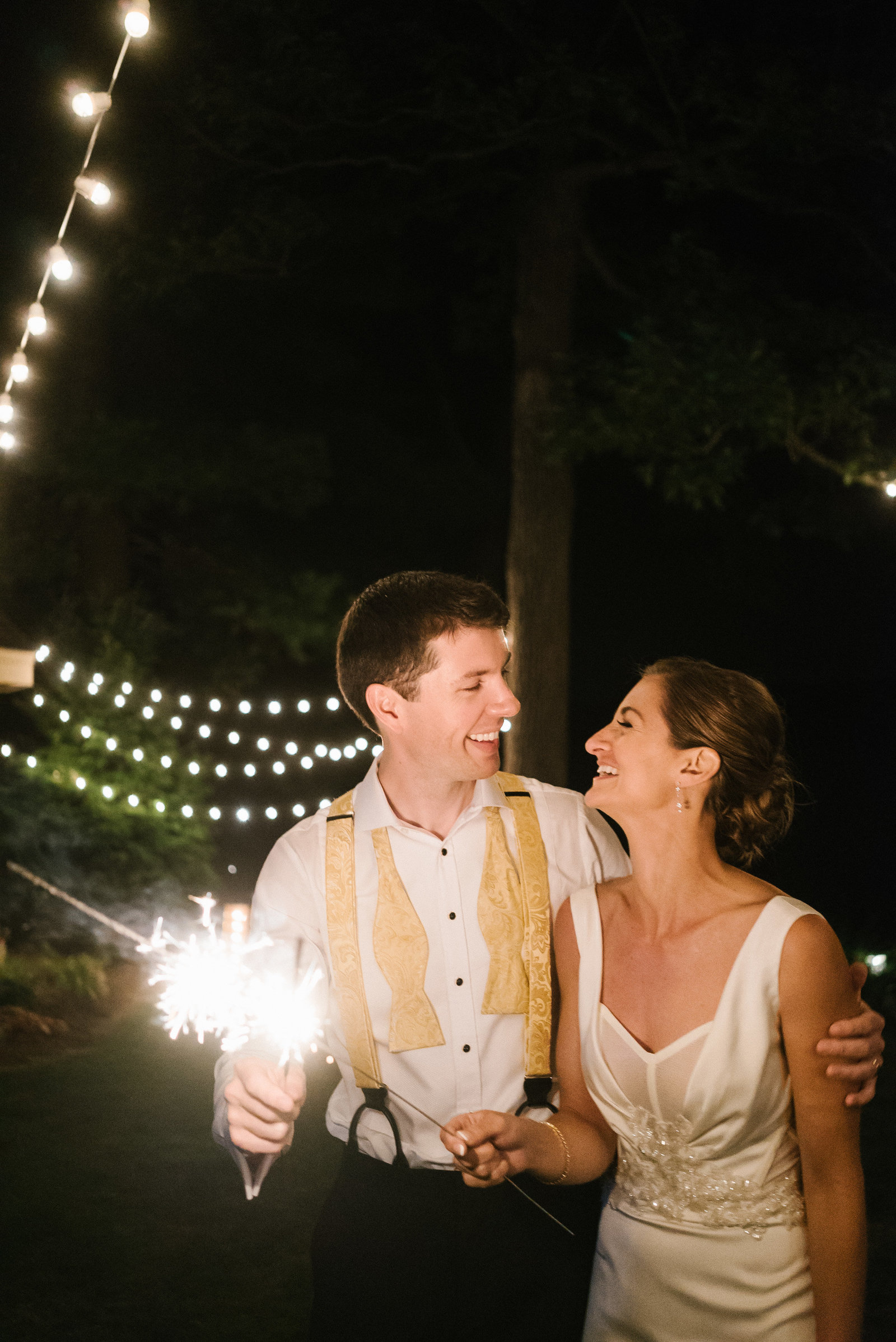 Sparkler fun before the night comes down to a close at this garden wedding at Grace Winery.