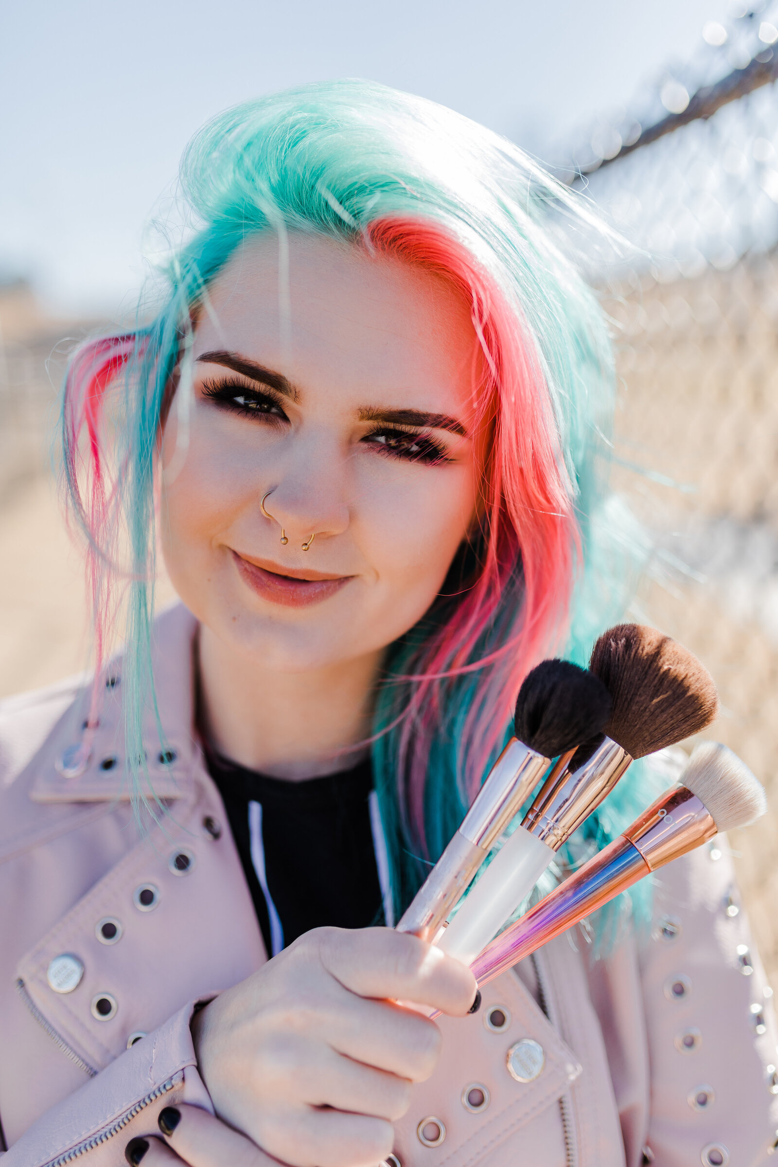 North Augusta branding photos in studio with girl holding makeup brushes with augusta branding photographer