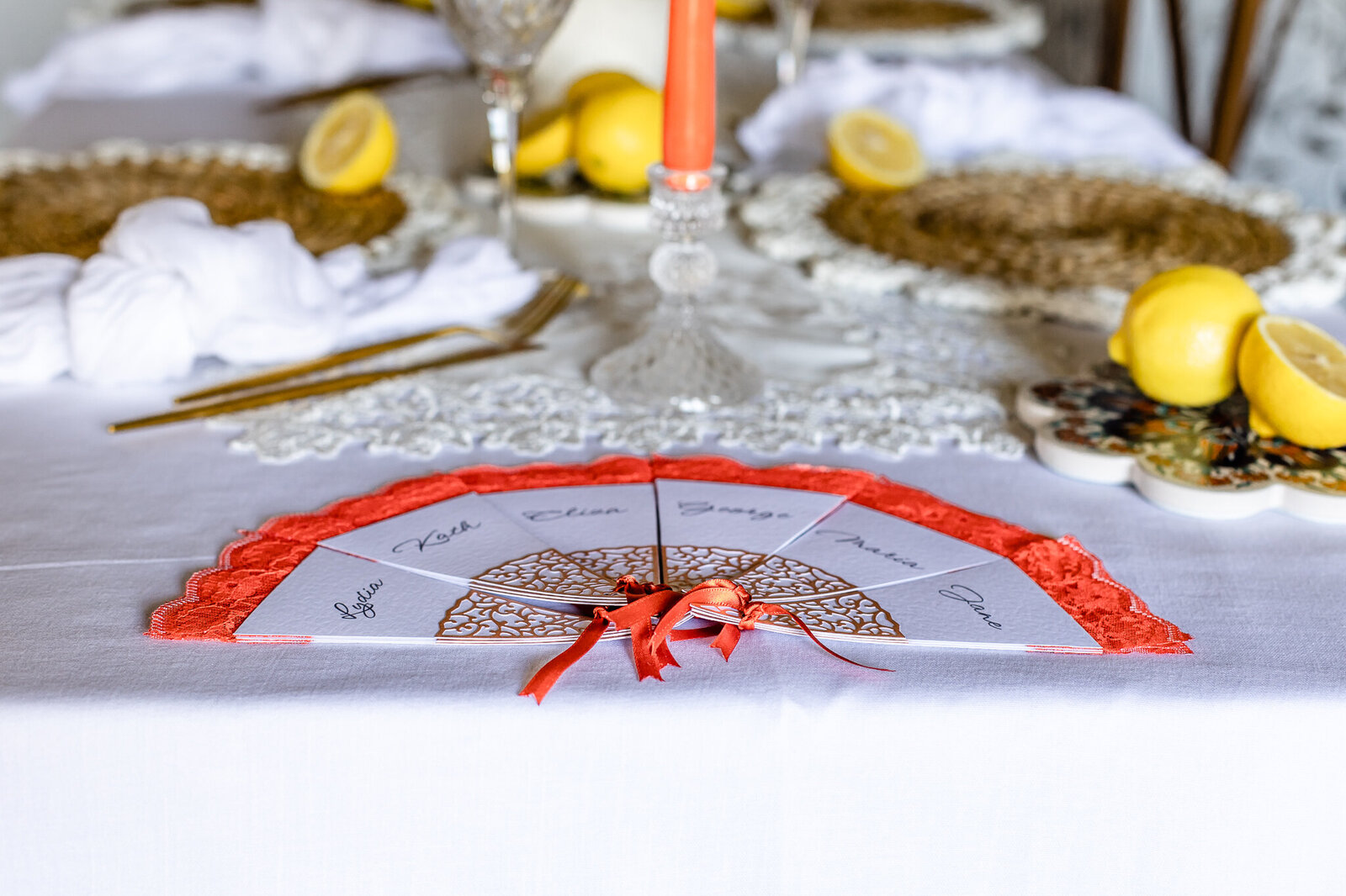 Fan-shaped wedding place cards laid out in escort card style