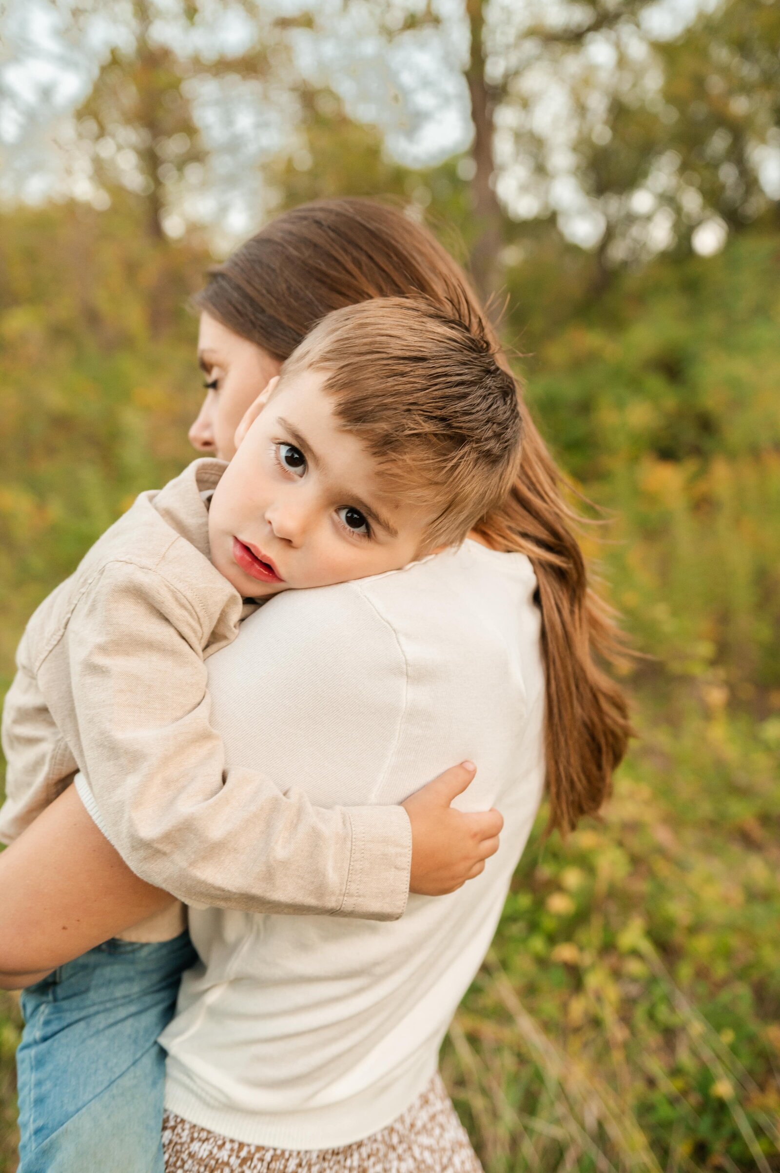 Mom hugging her children during a tender moment captured by a Baltimore family photographer.