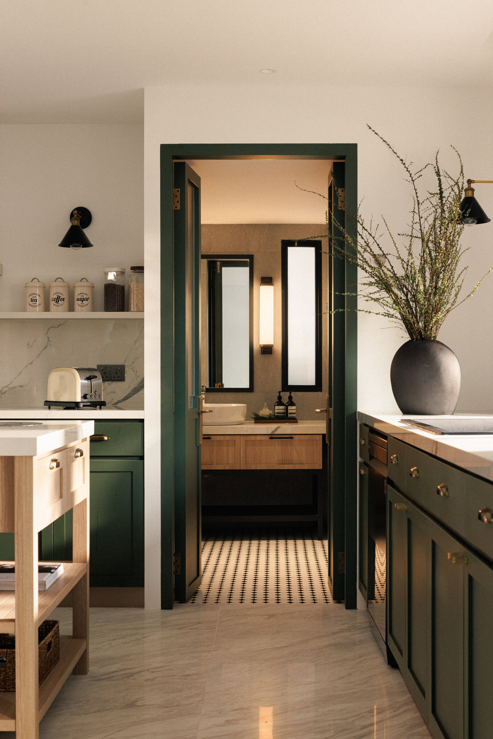 wide view of a kitchen with island and island stools