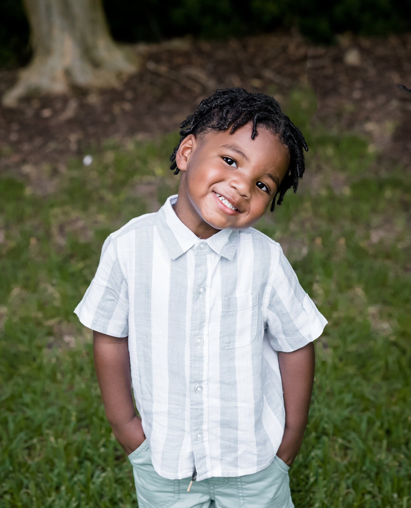 little boy in park smiling